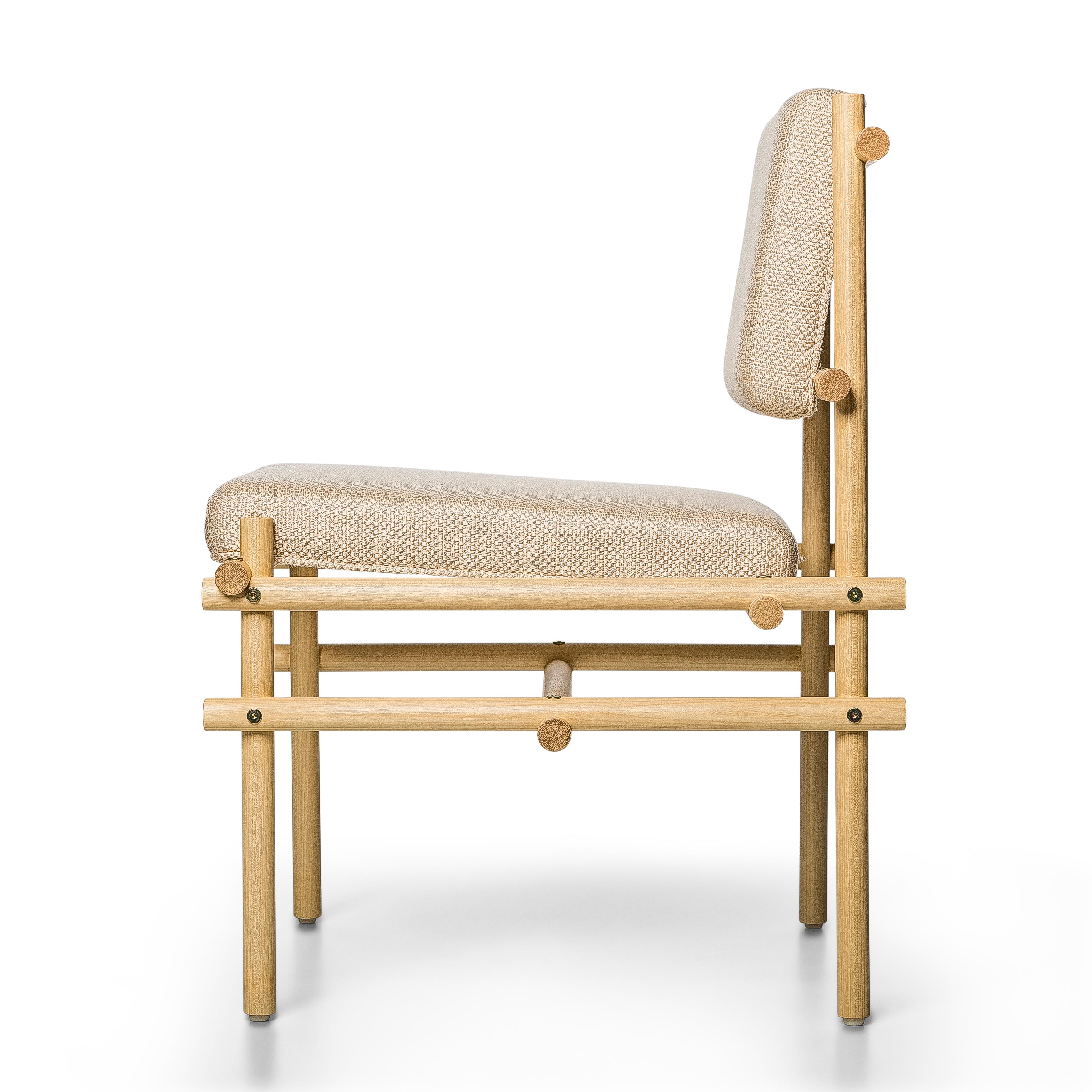 Developed under the premise of Brazilian traditional joinery concepts, Pipa chair is made with Tauari rods, all of the same thickness and with simple inserts and exposed screws.

The chair suggests a natural and organic aspect, but shows a strong