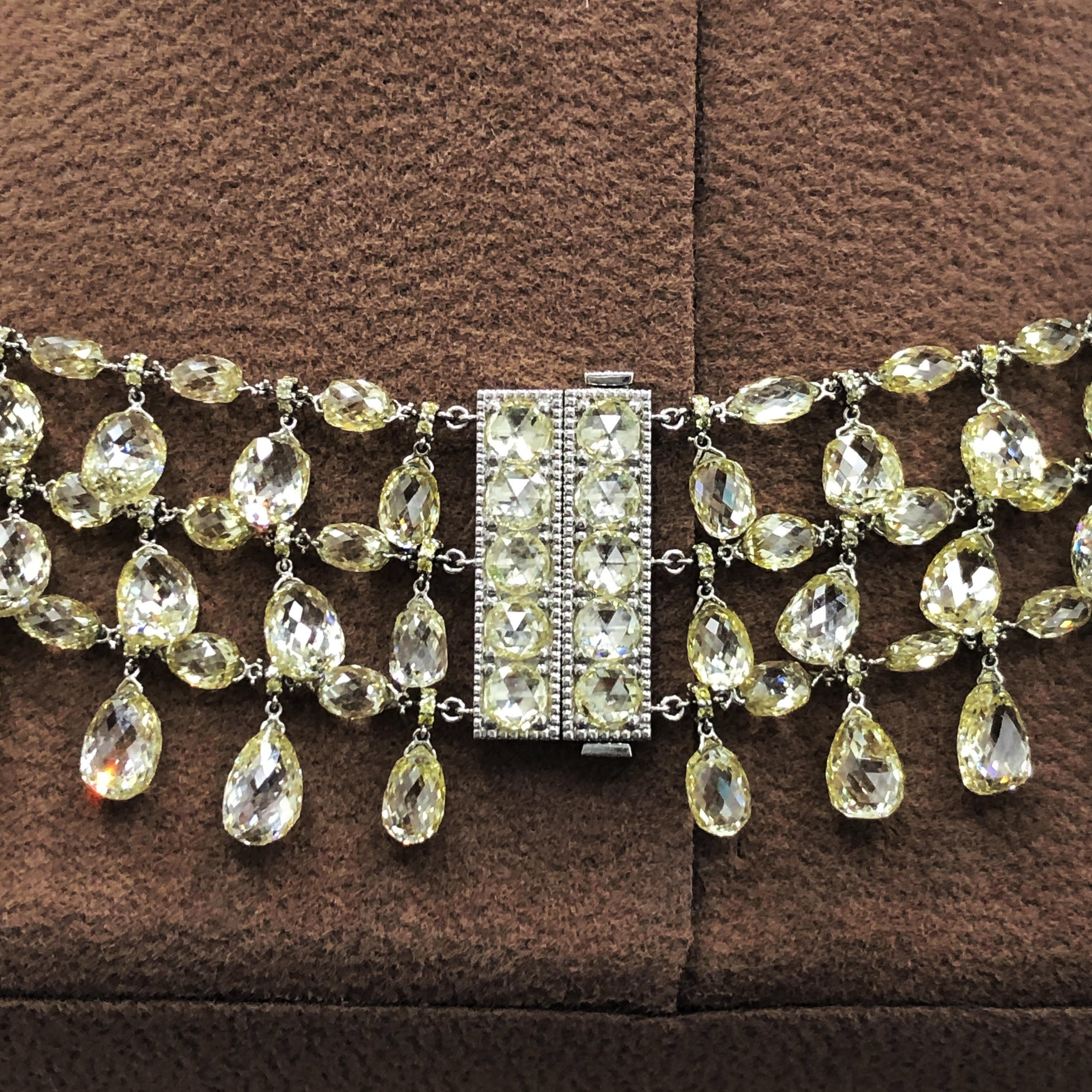 This Necklace Features In House Developed Single and Double Drilled Total 297 Pieces Natural Yellowish Color Briolettes Weighing 220.46 Carats Set With 4.65 Carats Rosecut Diamonds Beautifully Hand Crafted in 62.42 Grams 18 Karat Gold. 
This