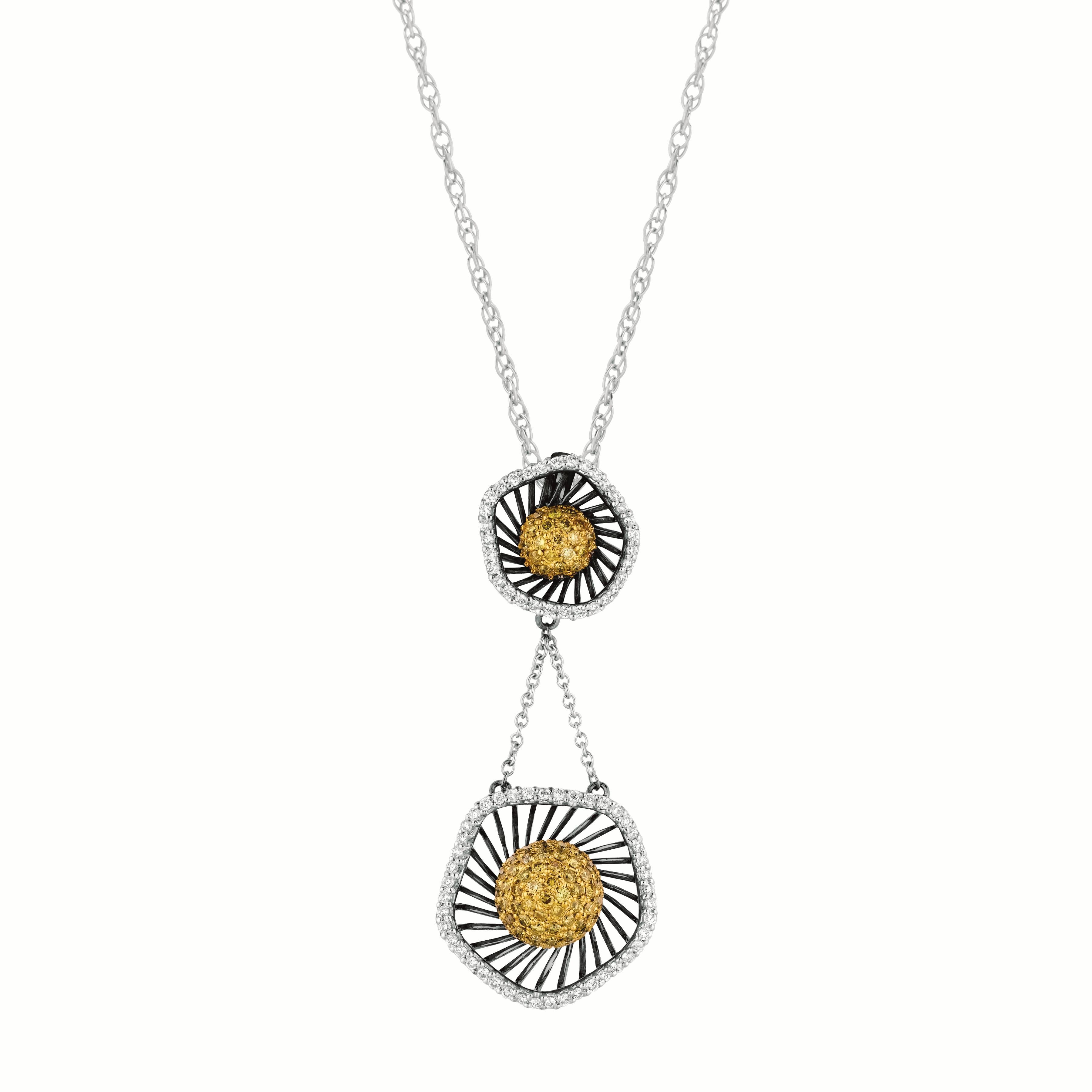 Elevate your style with this exquisite pendant showcasing 148 natural fancy brown and white diamonds. Crafted in 18k gold, this pendant offers a unique and lightweight design that will make a statement.

The combination of natural fancy brown and