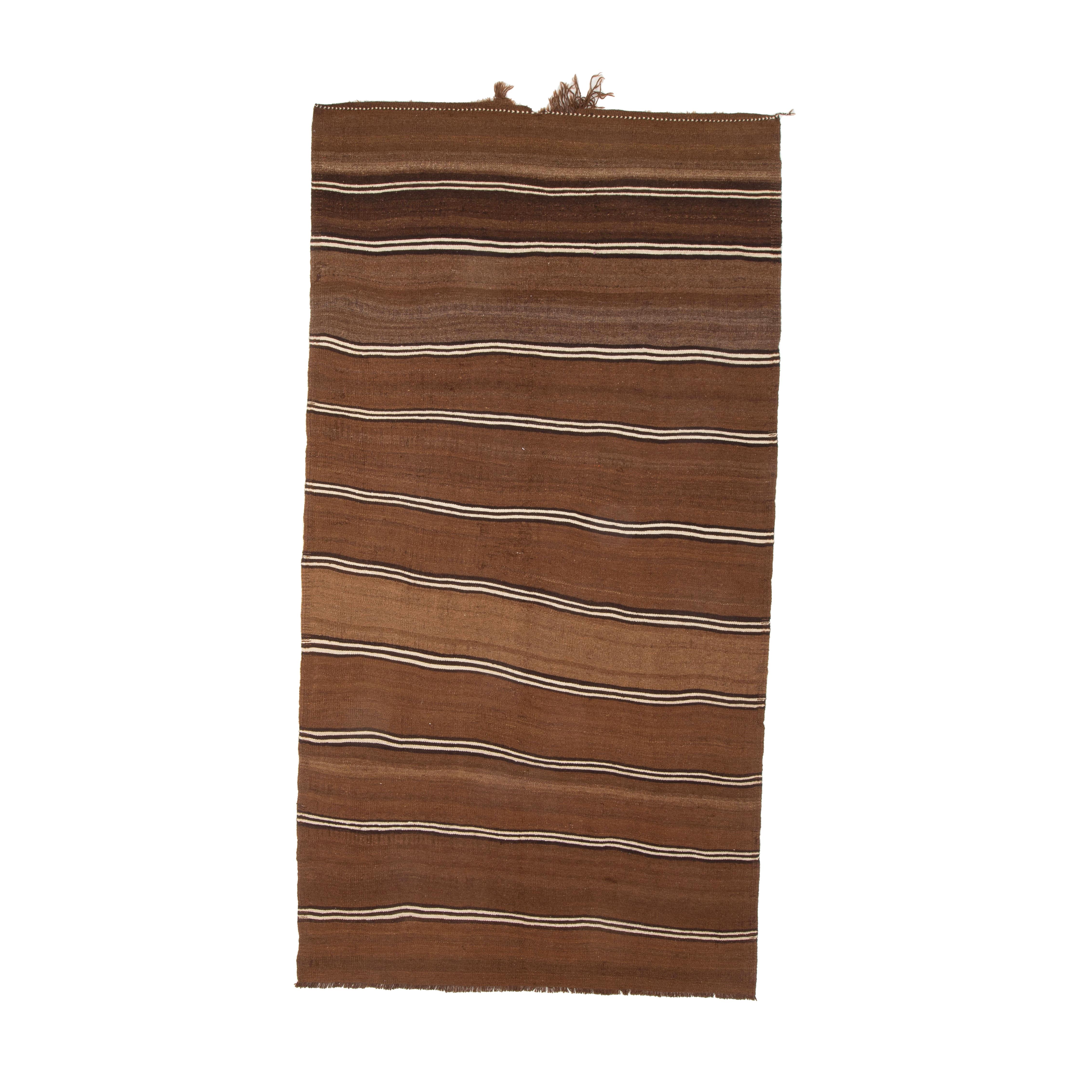 a solid, dtrong kilim woven with undyed wool from Eastern Turkey.