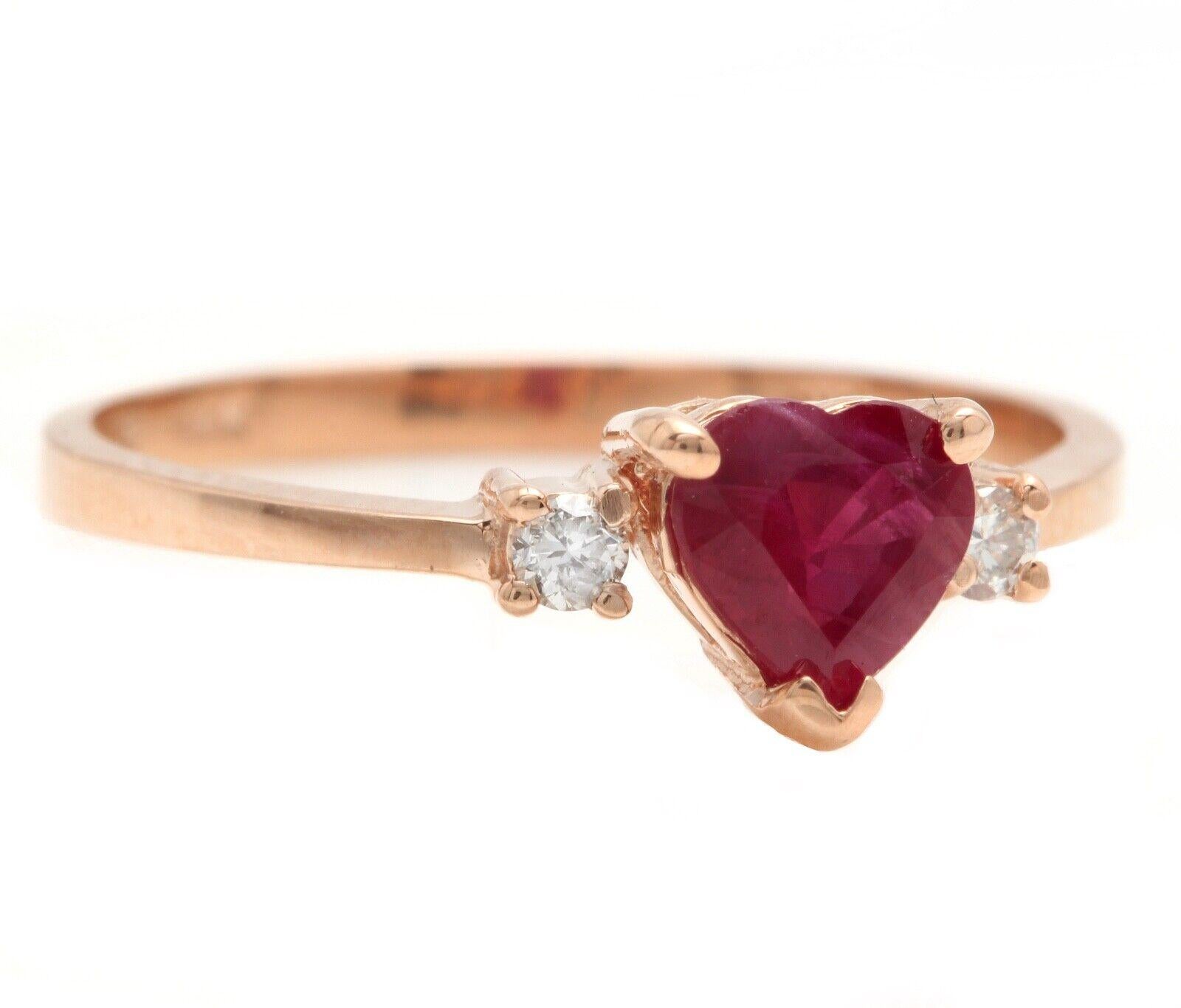Impressive Natural Red Ruby and Diamond 14K Solid Rose Gold Heart Ring

Suggested Replacement Value $2,500.00

Total Natural Red Ruby Weight is: Approx. 0.70 Carats 
 
Natural Round Diamonds Weight: Approx. 0.08 Carats (color G-H / Clarity SI)

Ring