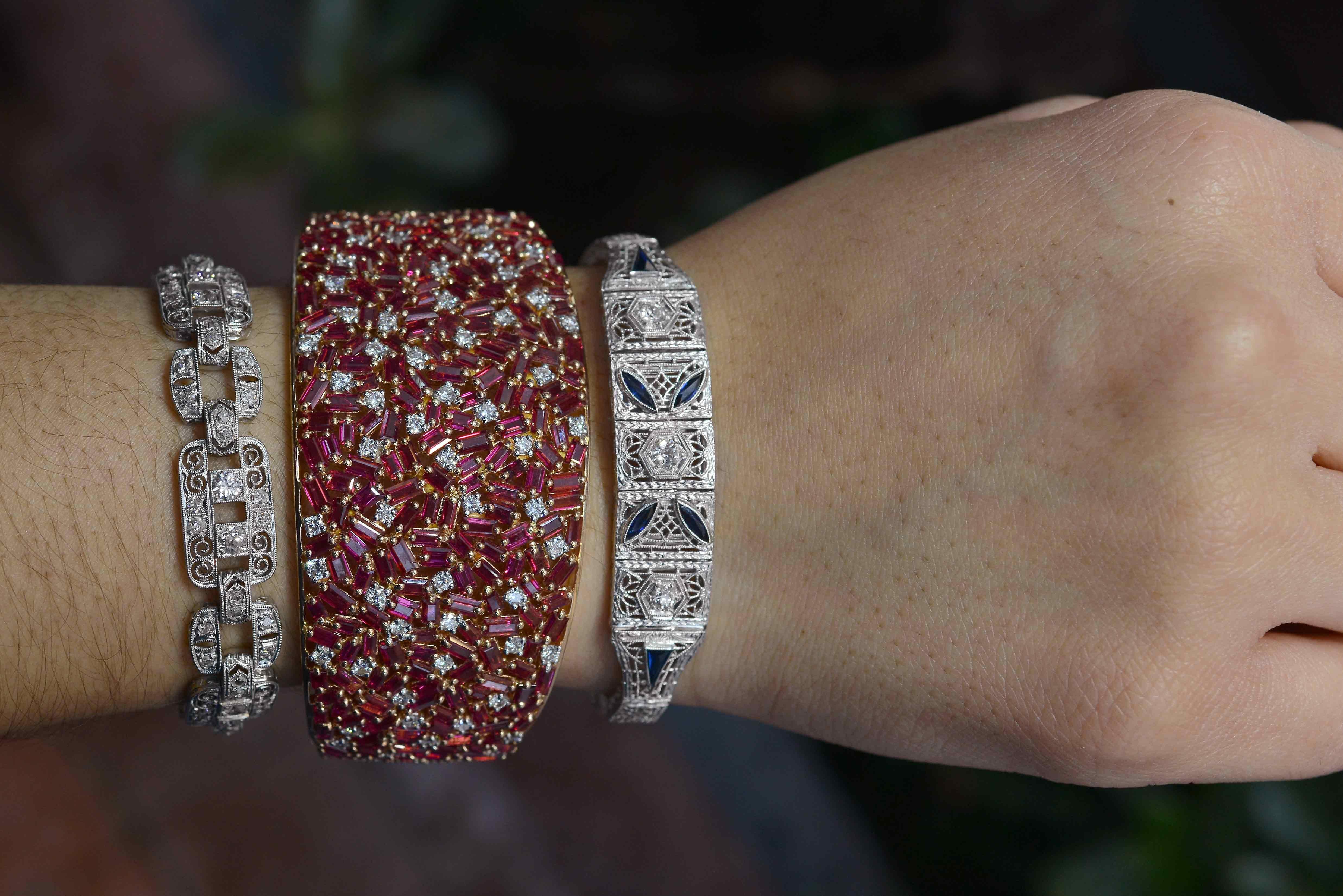 A most exciting Natural Burmese Ruby and diamond cuff bangle bracelet. The rich, vibrant Burma rubies glow with a rich, lustrous red and are certified as natural, unheated with a laboratory report. Talk about a statement piece! At over 2 1/2