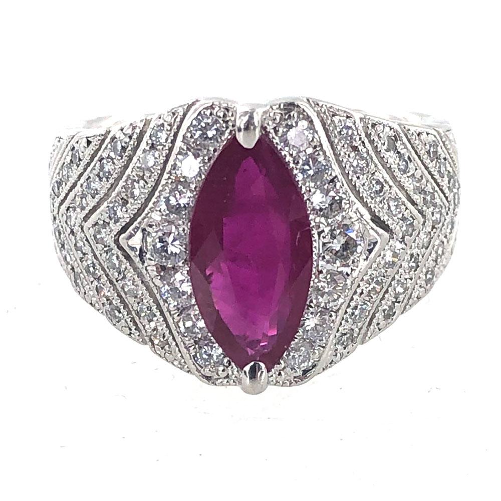 This magnificant natural ruby ring exudes beautiful red color and brilliance. The GIA certified natural ruby is of Burma origin. The marquise shape ruby is surrounded by 64 round brilliant cut diamonds (.65 carat total weight) graded G-H color and
