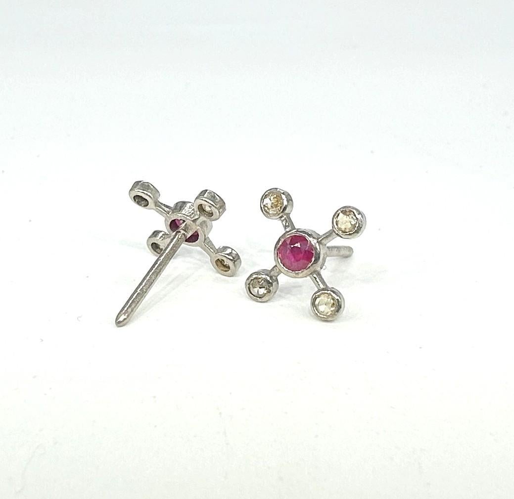 This pair of beautiful earrings consists of:

Diamond type- Rose cut diamonds
Diamond color- tinted brown
Diamond origin- Natural
Metal- Silver (with 18k Yellow Gold plated)
Metal purity- 925 silver or sterling silver
Metal color- Oxidized