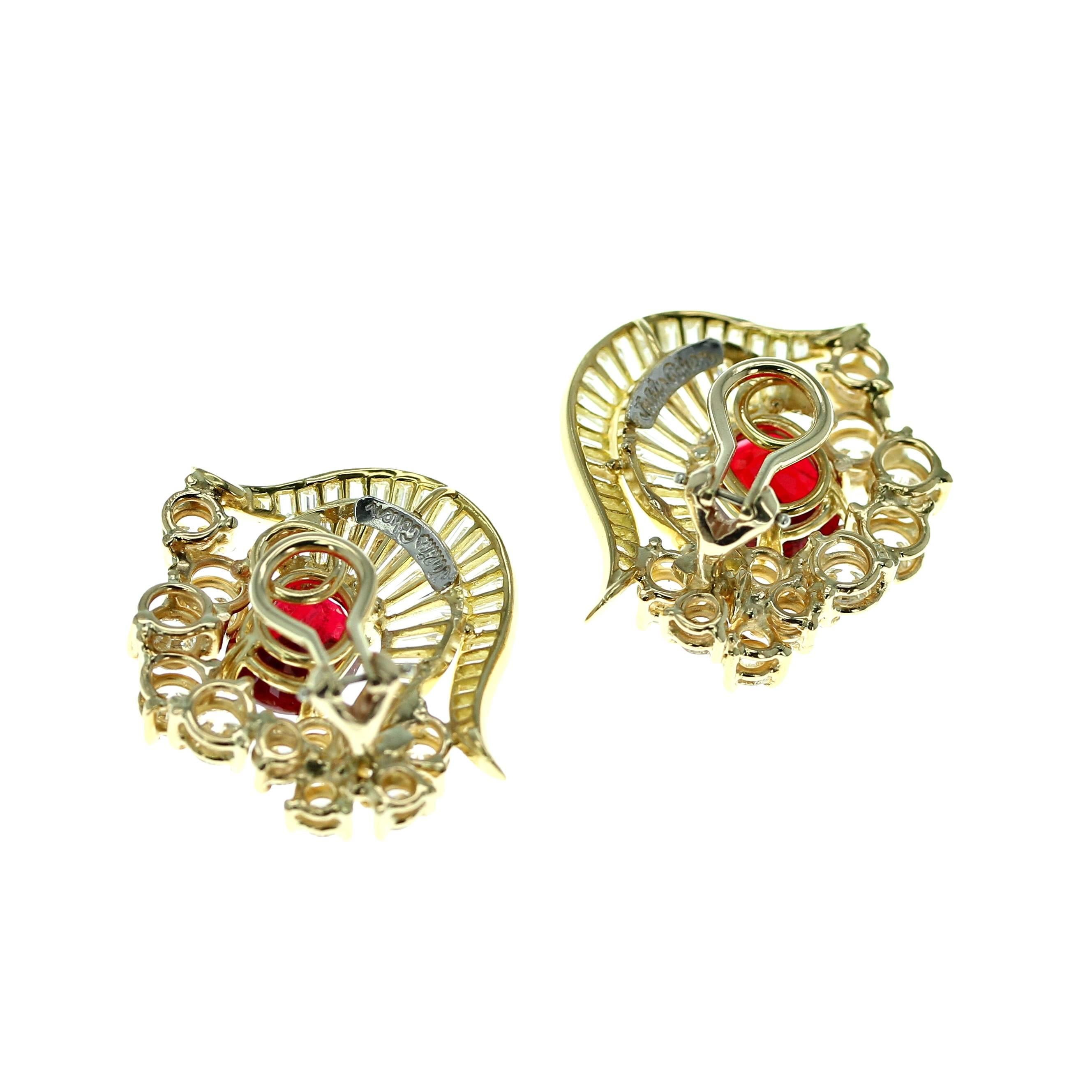 An elaborate pair of yellow gold earrings set with two cushion shape natural, no heat spinels from Burma (Myanmar), weighing over six carats total, accented with two hooves set with diamond baguettes and a row of round brilliant-cut diamonds; french