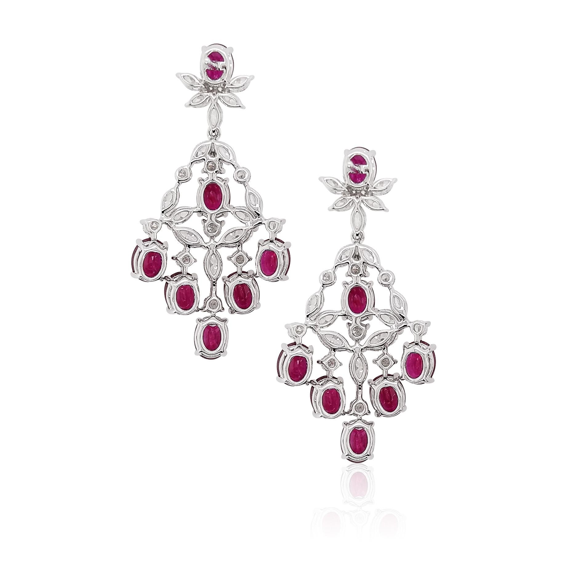 These gorgeous earrings feature vinaceous and lustrous, high-quality Burmese Rubies, accentuated by 18 Karat white gold and scintillating white diamonds. A contemporary way to wear rubies, these striking earrings will elevate any outfit.
-	Oval