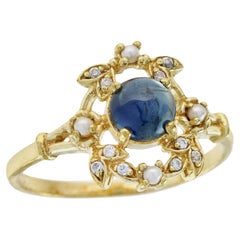 Bague de style vintage en or massif 9 carats avec saphir bleu cabochon naturel et perle