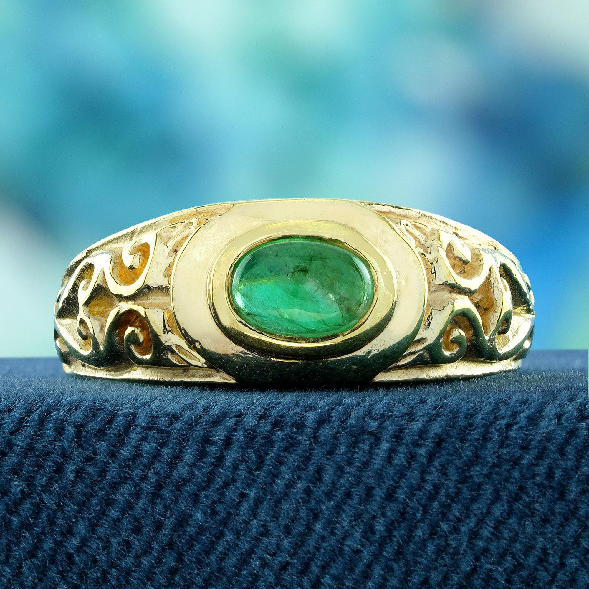 Indulge in the elegance of our Natural Cabochon Emerald Vintage Style Carved Band Ring in Solid 9K Yellow Gold. This ring showcases a stunning natural emerald that is expertly carved and set in a durable yet elegant band. The ring is made of solid