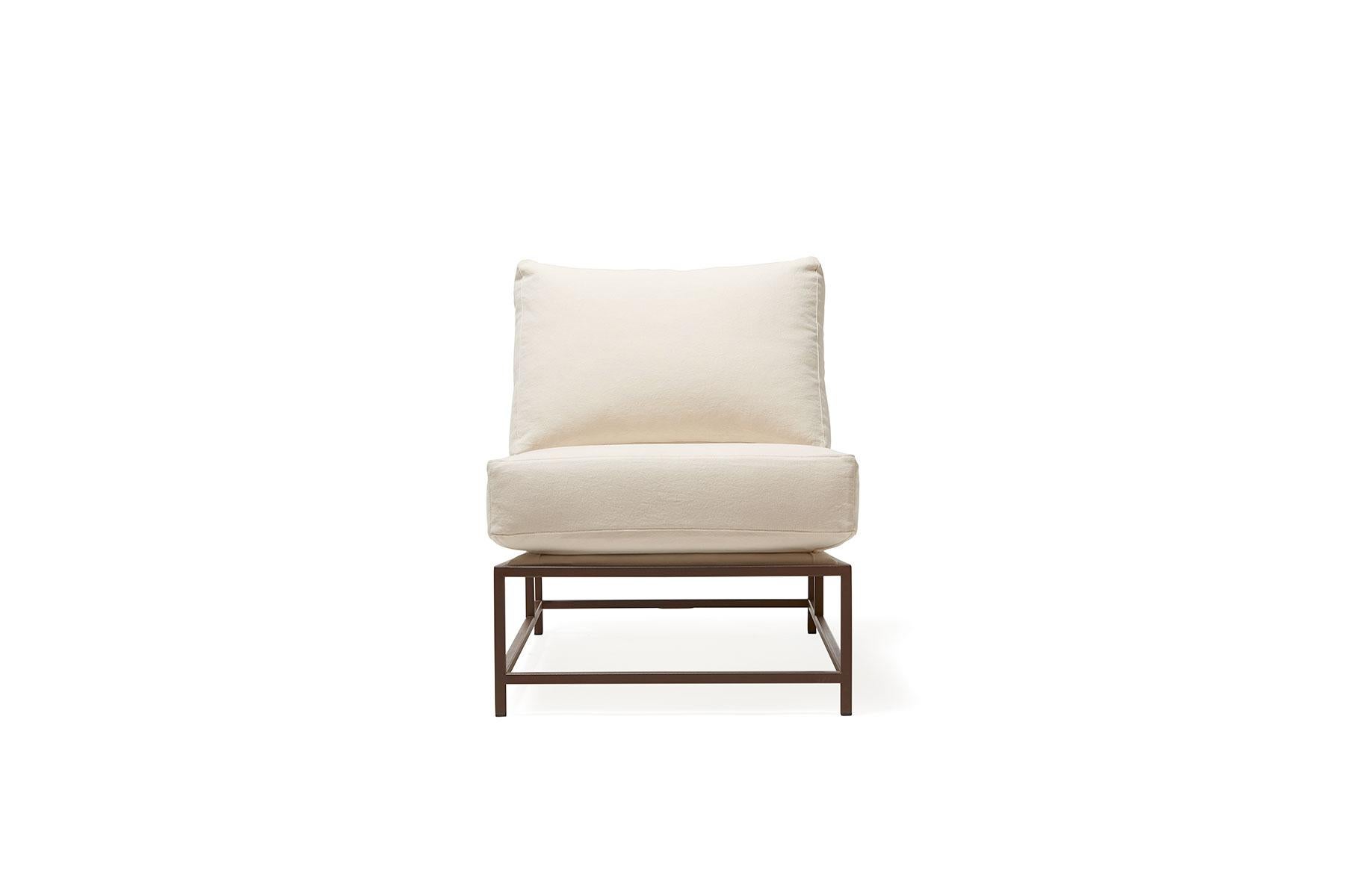 Sleek and refined, the chair from Stephen Kenn's Inheritance Collection is a great addition to nearly any space.

This variation is upholstered in natural canvas. The foam seat cushions have been wrapped in polyfiber, allowing for a soft and