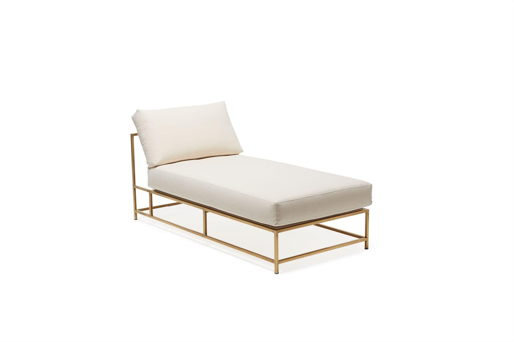 The Inheritance Chaise Lounge by Stephen Kenn is as comfortable as it is unique. The design features an exposed construction composed of three elements - a steel frame, plush upholstery, and supportive belts. The deep seating area is perfect for a