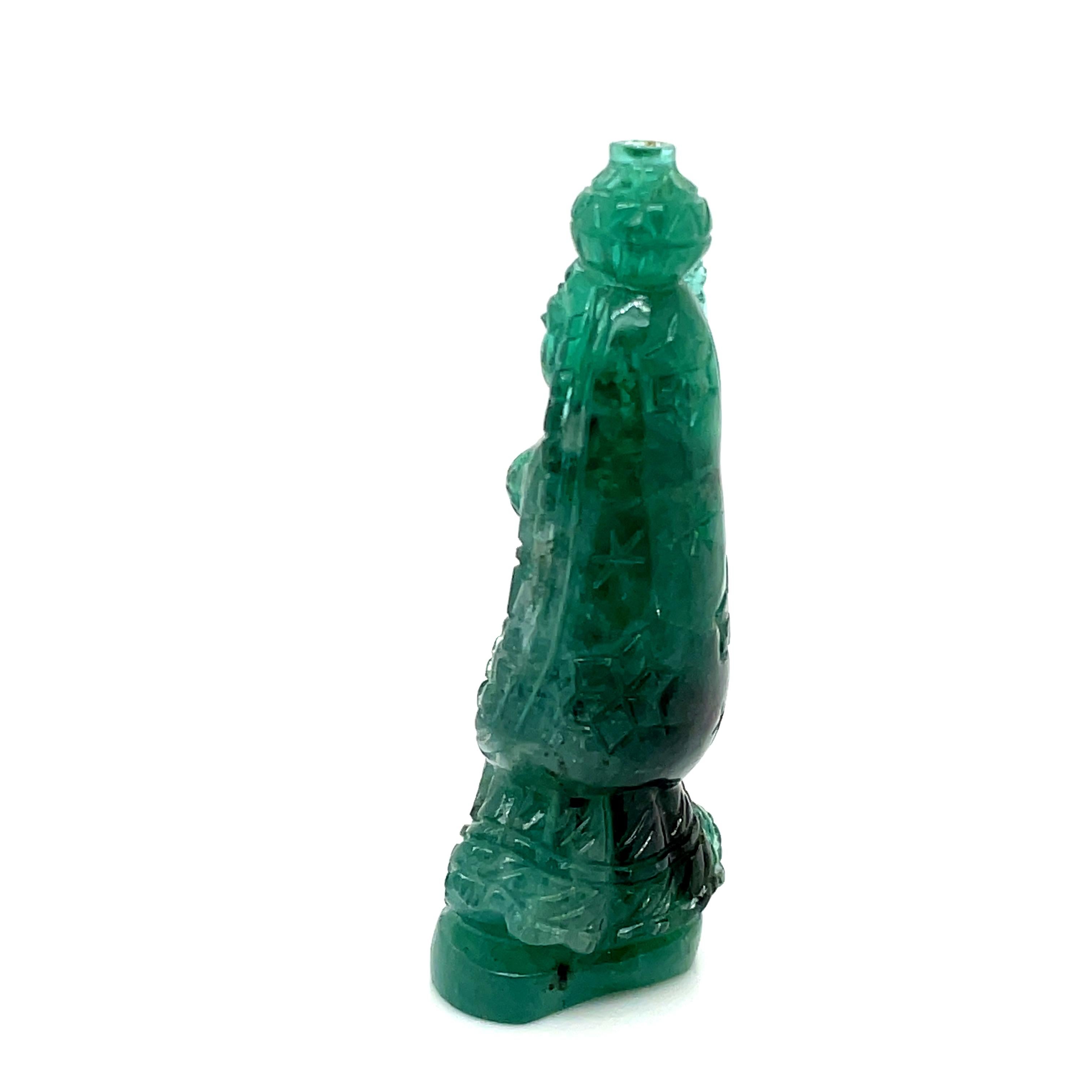 Contemporary Natural Carved Emerald Cts 106.02 Lady Holding Makta For Sale