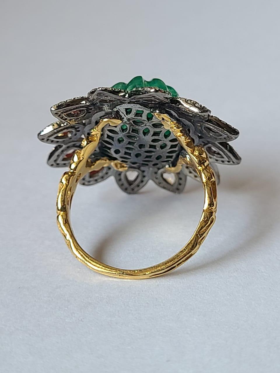 A very gorgeous Emerald & Diamonds, Victorian style, Art Deco Cocktail Ring set in 14K Gold & 925 Silver. The weight of the carved Emerald is 9.08 carats. The Emerald is completely natural, without any treatment and is of Zambian origin. The weight