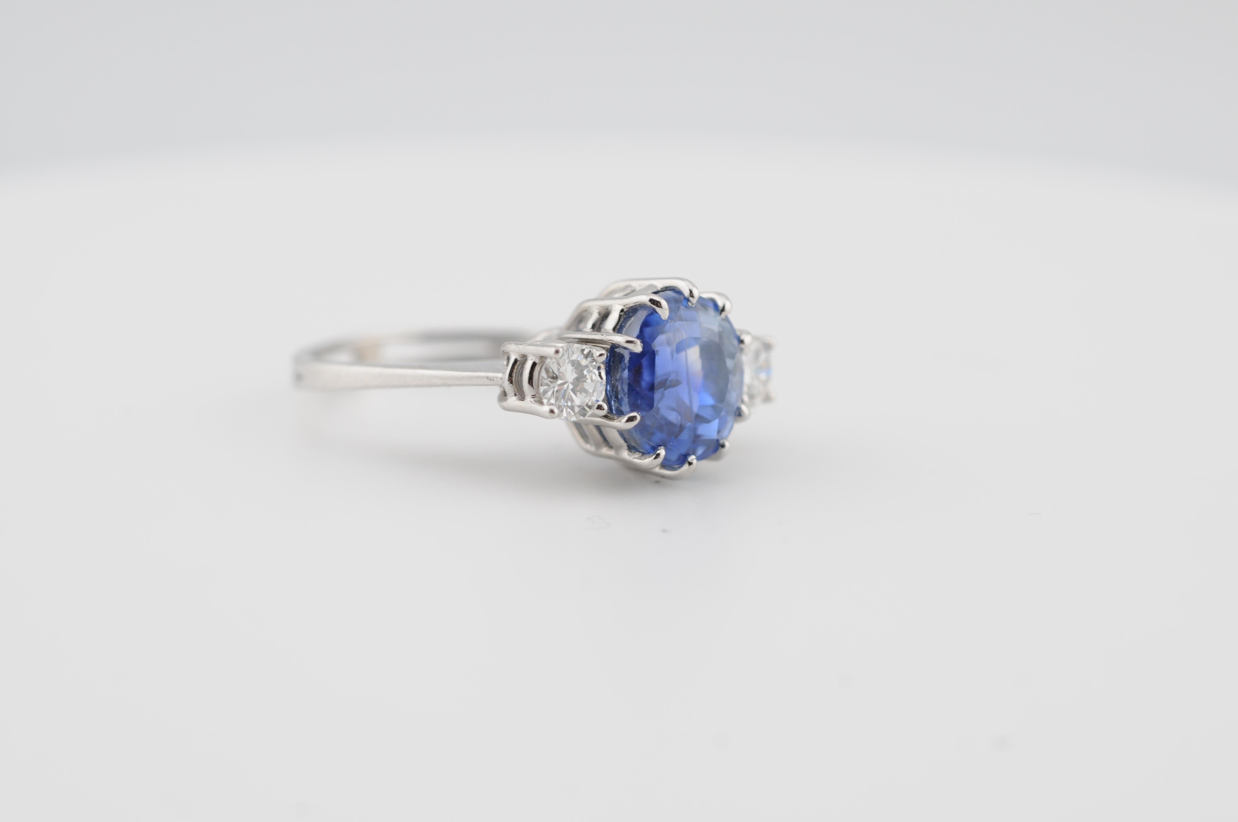 A beautifully crafted ring featuring a 4.5-carat natural Ceylon sapphire of exceptional cornflower blue color, certified untreated (no heat) by DSEF Idar-Oberstein.

The sapphire is accented by two brilliant-cut diamonds, each weighing approximately