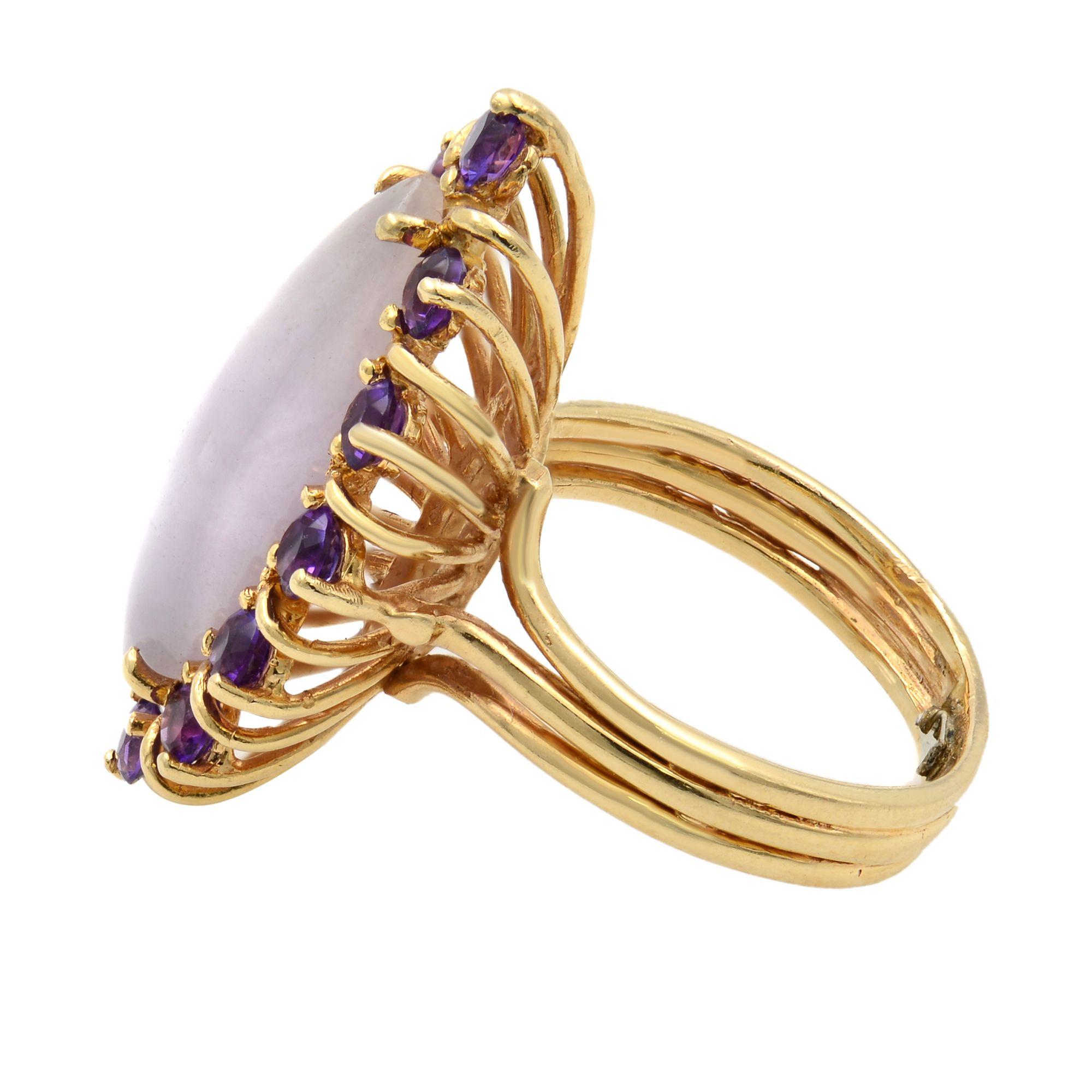 This Vintage piece of art is crafted in 14k yellow gold. It features an elegant marquise shape, natural Chalcedony gemstone with a halo of 12 round cut Amethyst gemstones. Top of the ring measurements: 28x15mm. Ring size 6. Comes with a presentable