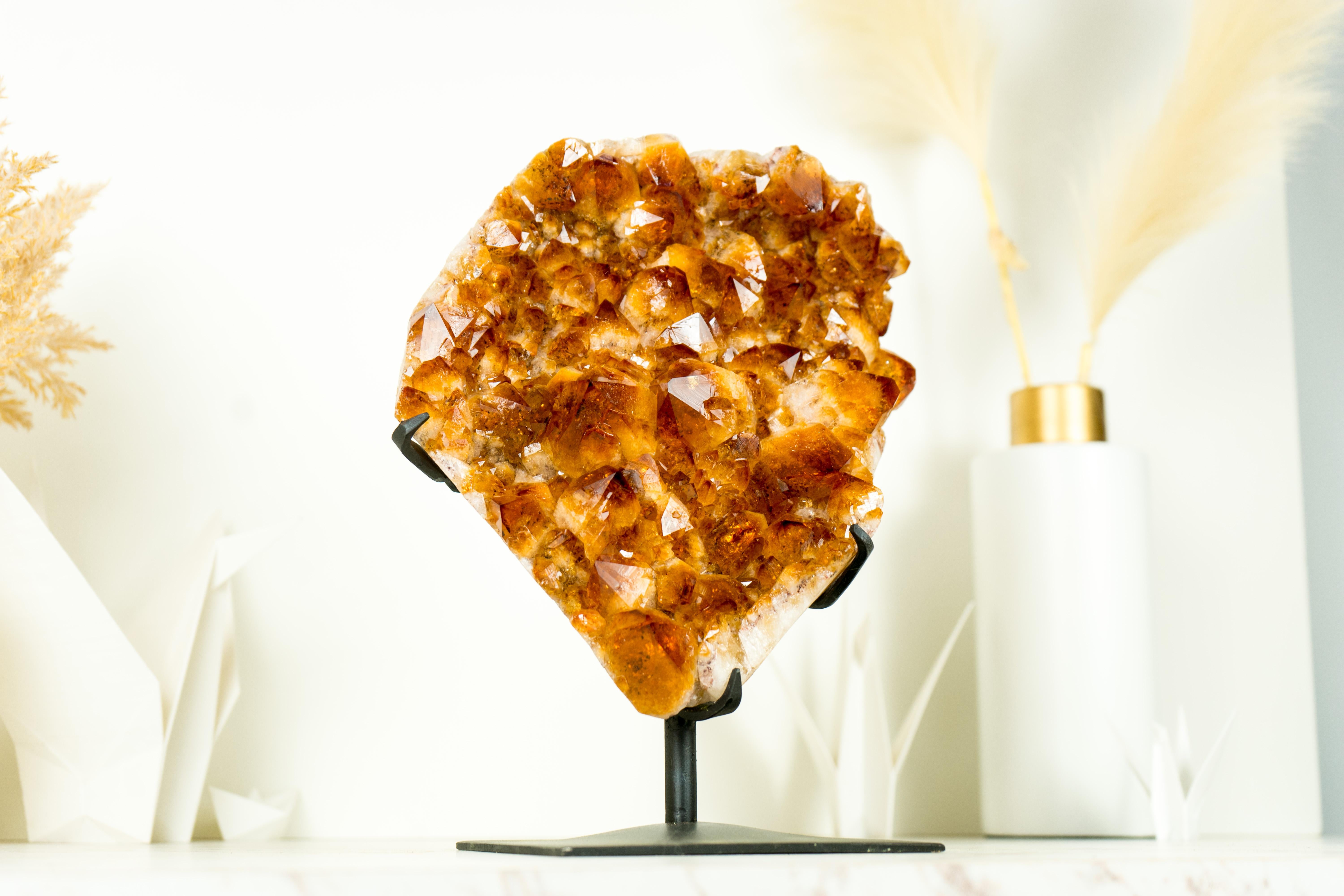 Bringing unusually large Madeira Orange Druzy, this Citrine Cluster resembles a natural fiery bouquet of the utmost beauty, that will add to any space you decide to exhibit it. A prized addition to any gemstone collection or home decor, adding