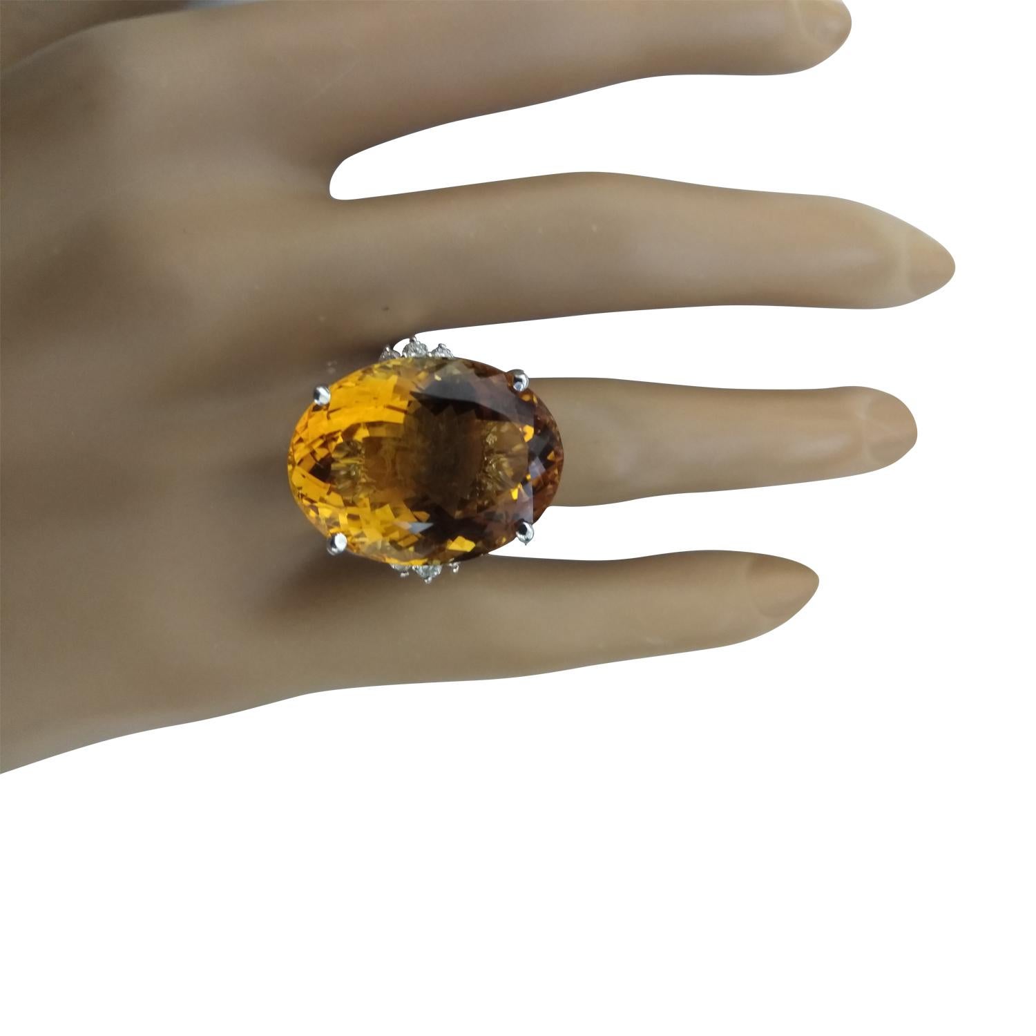 23.65 Carat Natural Citrine 14 Karat Solid White Gold Diamond Ring
Stamped: 14K 
Total Ring Weight: 11.3 Grams 
Citrine Weight 23.40 Carat (20.00x15.00 Millimeters)
Diamond Weight: 0.25 carat (F-G Color, VS2-SI1 Clarity )
Face Measures: 20.00x20.85