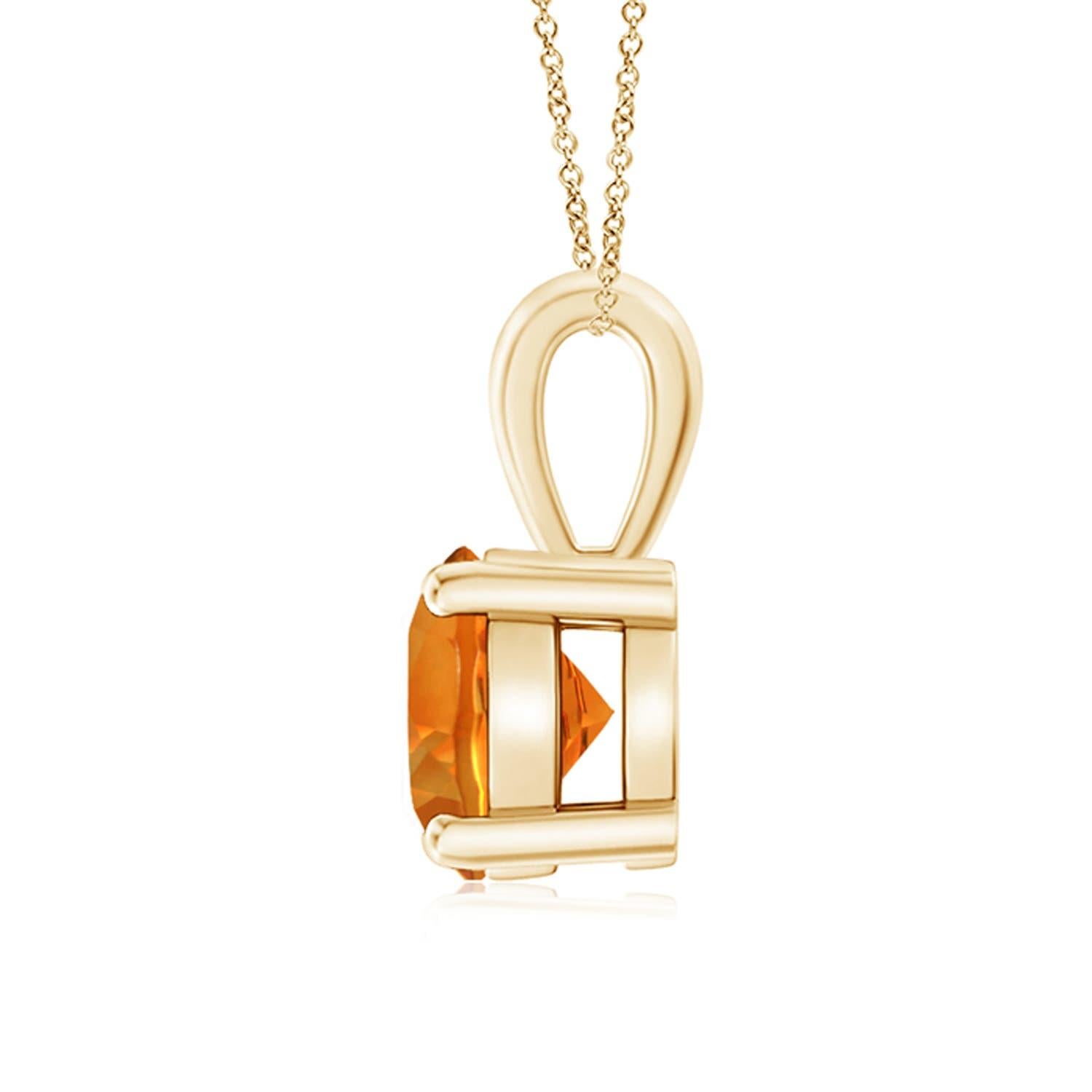 Une citrine étincelante est reliée à une balle unique et est fixée dans une monture à quatre griffes. Ce pendentif solitaire en citrine présente un design simple et attire toute l'attention sur sa teinte jaune miel. Il est réalisé en or jaune 14k.