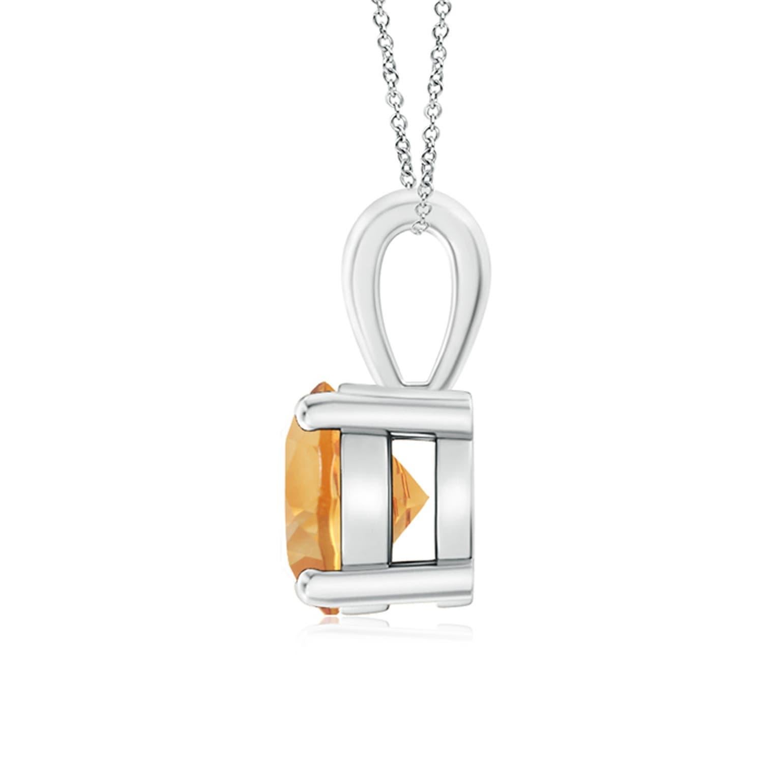 Une citrine étincelante est reliée à une balle unique et est fixée dans une monture à quatre griffes. Ce pendentif solitaire en citrine présente un design simple et attire toute l'attention sur sa teinte jaune miel. Il est réalisé en platine.