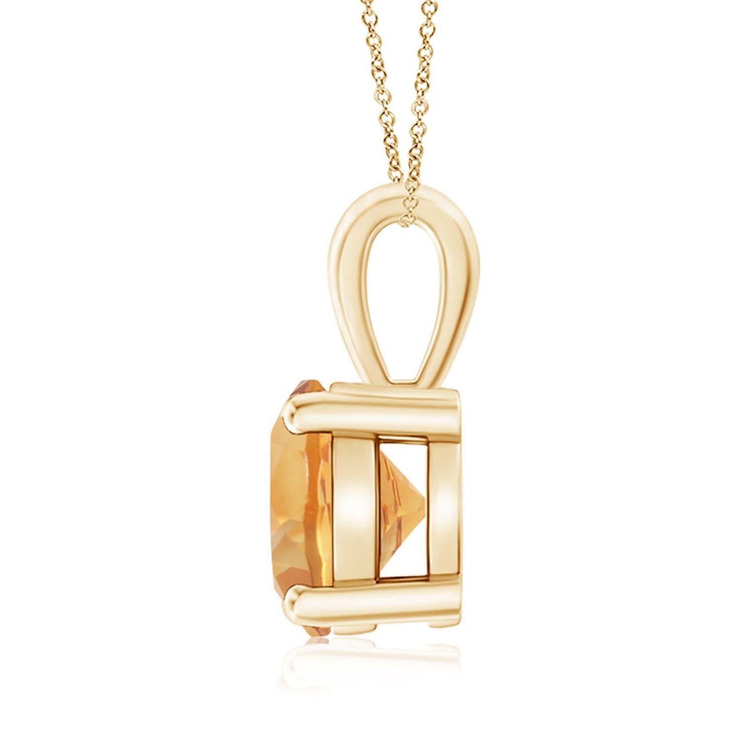 Une citrine étincelante est reliée à une balle unique et est fixée dans une monture à quatre griffes. Ce pendentif solitaire en citrine présente un design simple et attire toute l'attention sur sa teinte jaune miel. Il est réalisé en or jaune 18