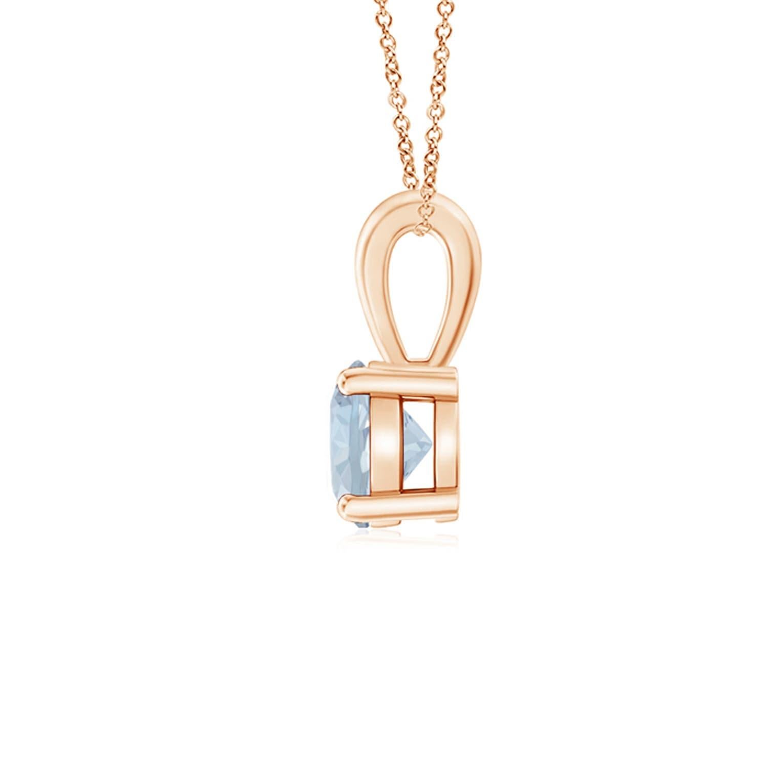 Linked to a lustrous bale is a sea blue aquamarine solitaire secured in a four prong setting. Crafted in 18k rose gold, the elegant design of this classic aquamarine pendant draws all attention towards the magnificence of the center stone. Available