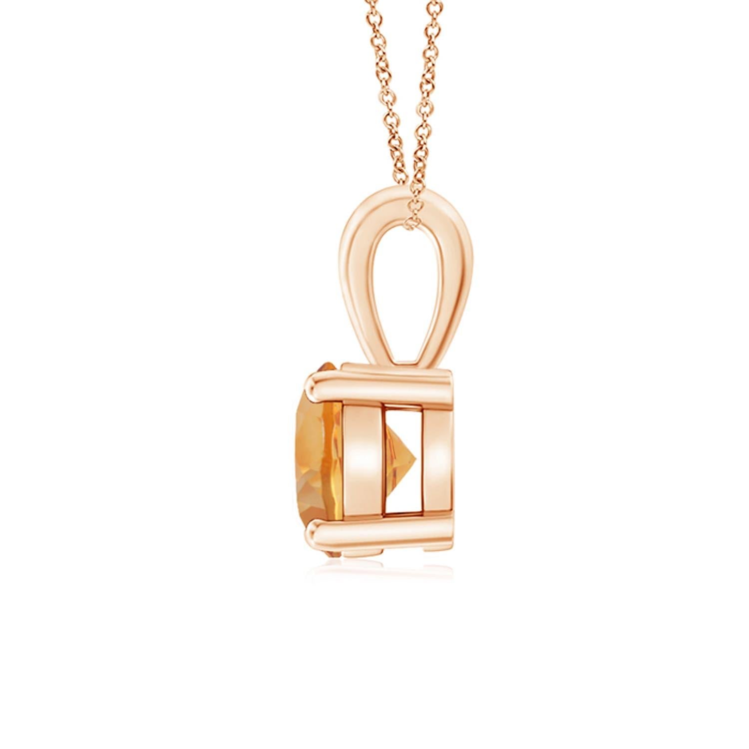 Une citrine étincelante est reliée à une balle unique et est fixée dans une monture à quatre griffes. Ce pendentif solitaire en citrine présente un design simple et attire toute l'attention sur sa teinte jaune miel. Il est réalisé en or rose 18