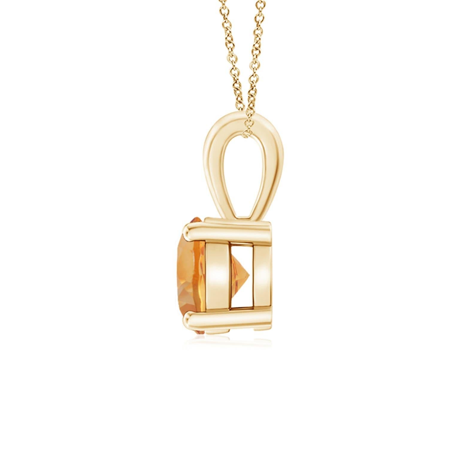 Une citrine étincelante est reliée à une balle unique et est fixée dans une monture à quatre griffes. Ce pendentif solitaire en citrine présente un design simple et attire toute l'attention sur sa teinte jaune miel. Il est réalisé en or jaune 18