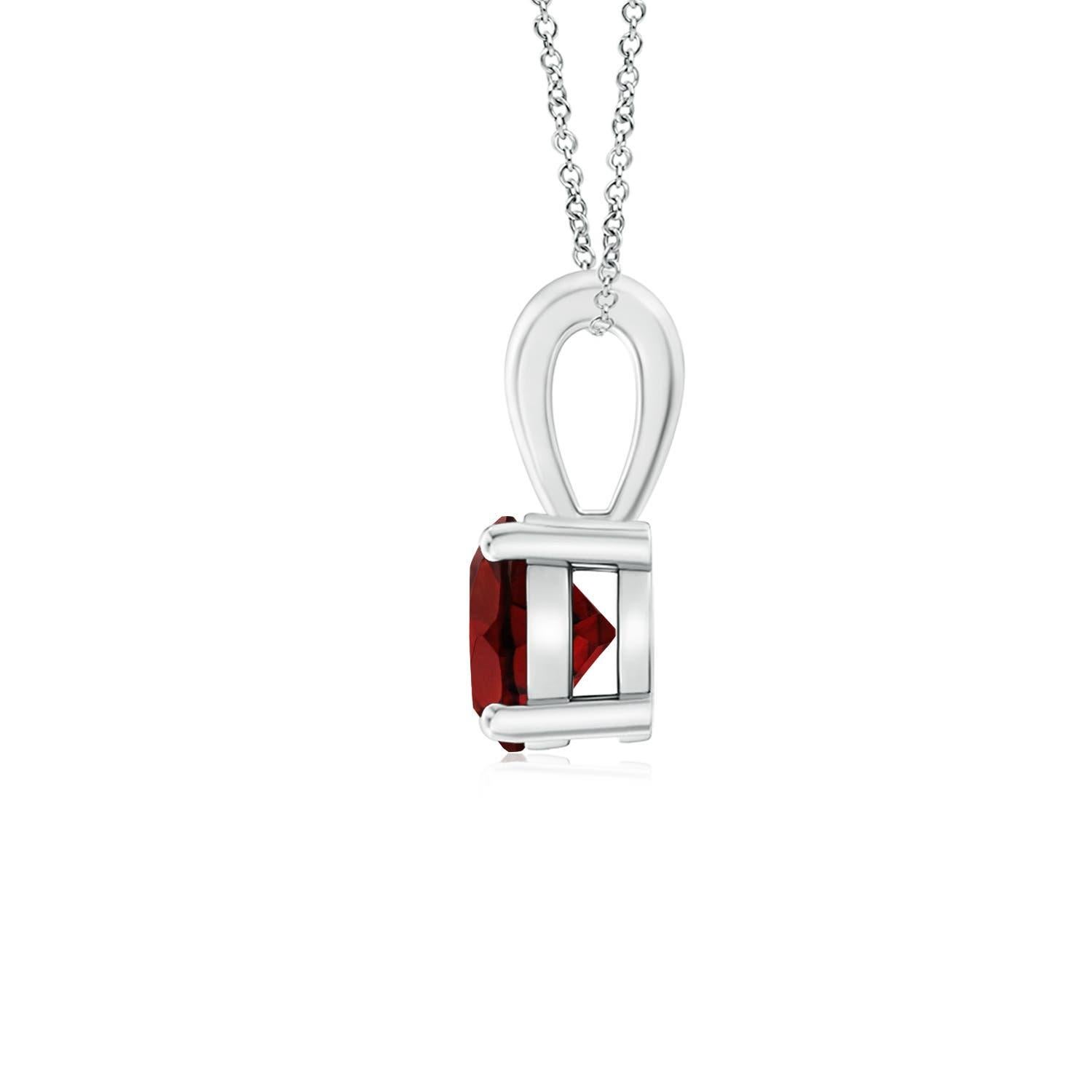 Linked to a single bale is a sparkling garnet secured in a four prong setting. This solitaire garnet pendant has a simple design and draws all the attention towards its deep red hue. It is crafted in platinum.
Garnet is the Birthstone for January