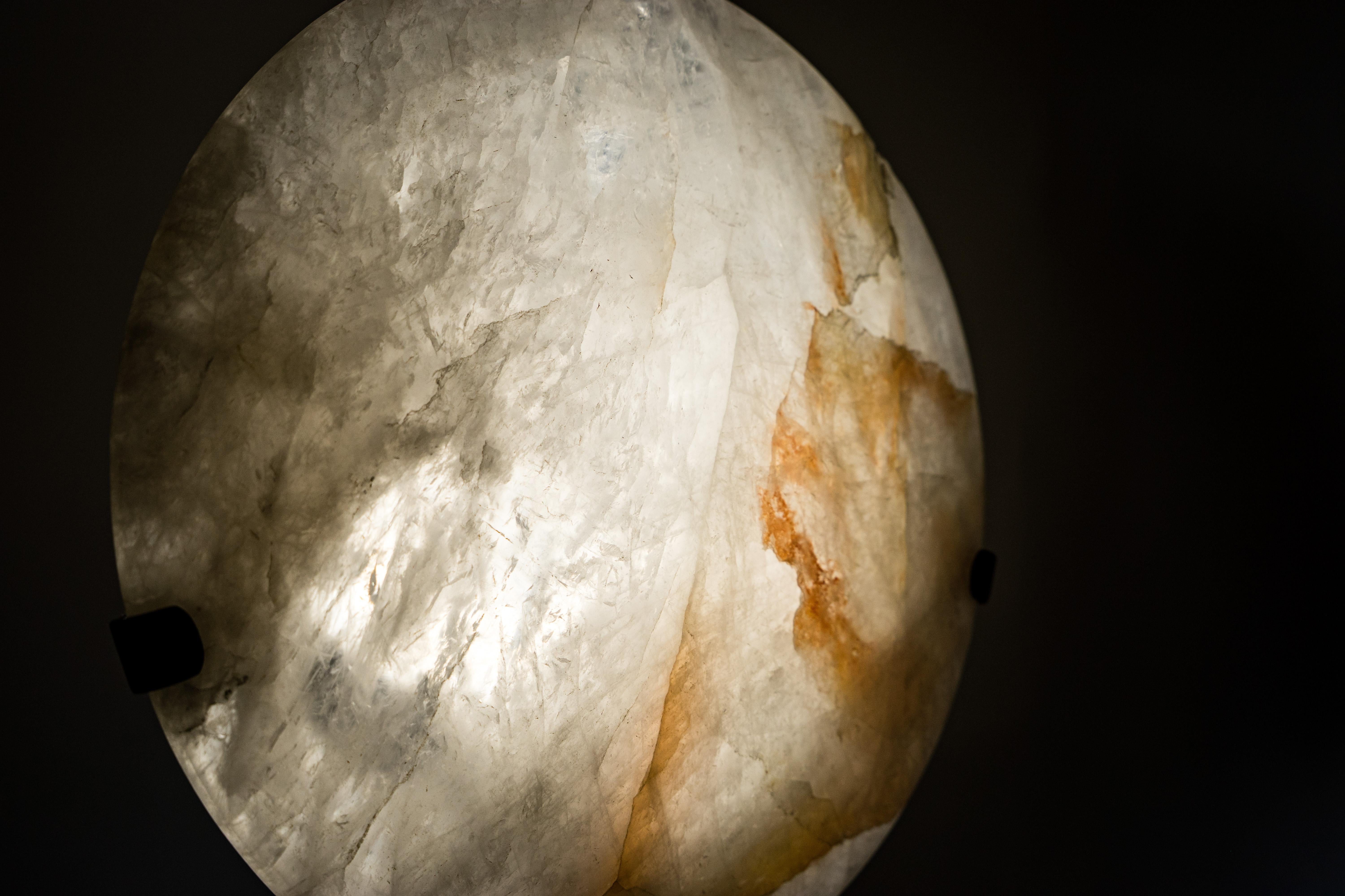 Crystal Quartz Lamp with Hematite Inclusions – Hand-sculpted Natural “Full Moon”

▫️ Description

Illuminate your space with the ethereal beauty of nature. This handcrafted quartz lamp features delicate hematite inclusions and creates a mesmerizing