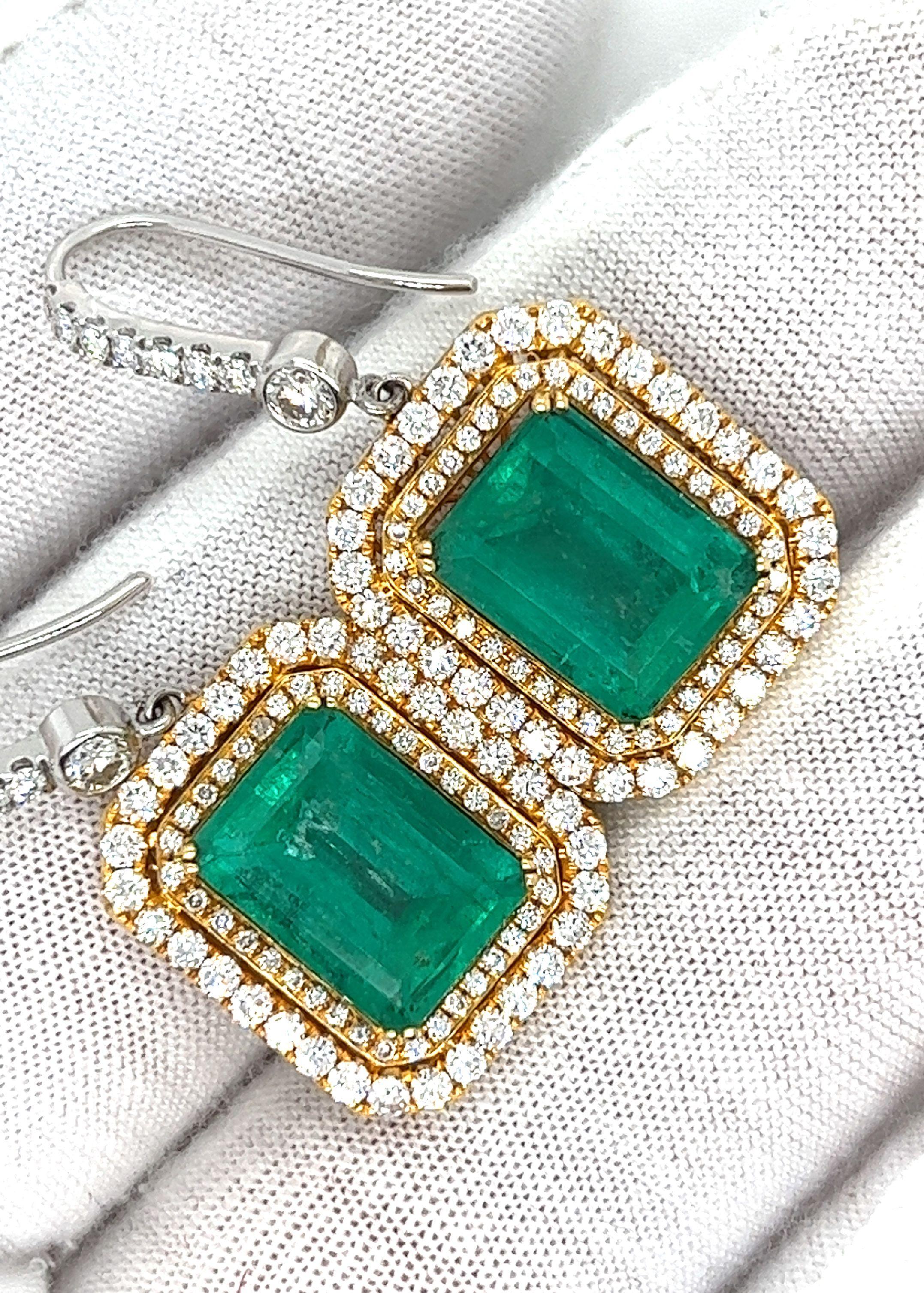 Contemporary Natural Colombian 7.36 CTTW Emerald & Diamond Halo Dangle Drop 18K Gold Earrings For Sale