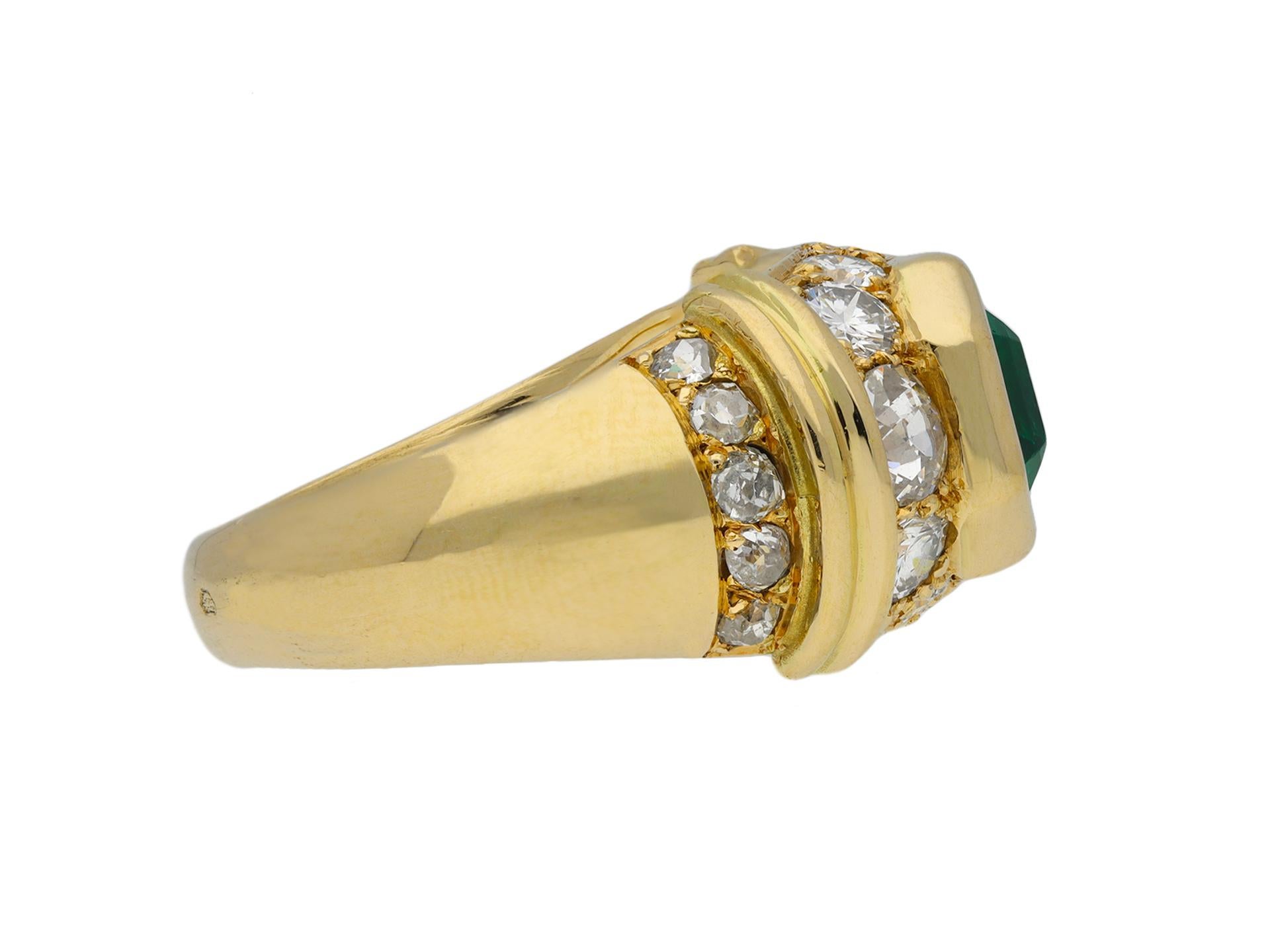 Colombian emerald and diamond ring. Set horizontally to center with an octagonal emerald-cut natural Colombian emerald with no colour enhancement in an open back rubover setting with an approximate weight of 1.60 carats, encircled by a single row of