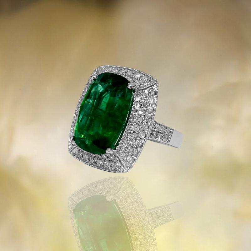 Metal: 14K white gold. 
1.50 carat diamonds, VS clarity and F color. 100% natural earth mined diamonds. 

7.25 carat emerald, cushion cut. Emerald dimensions: 7.93 x 6.99 mm. 100% natural earth mined emerald set in prongs. Certified by GIA graduate