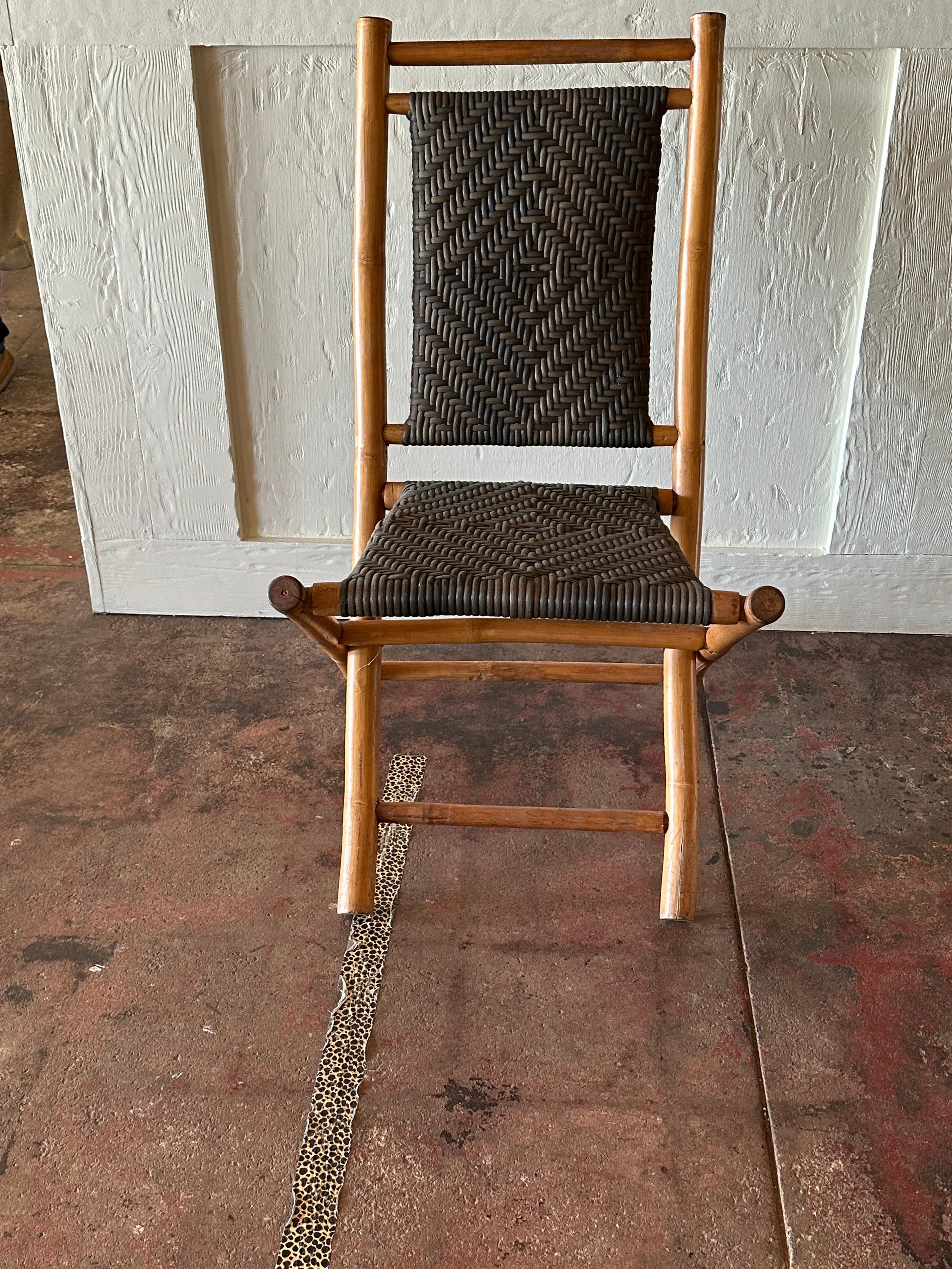 This pair of Natural Color Bamboo and Brown Rush Folding Chairs offers a blend of functionality and aesthetic.

Crafted from solid bamboo, these chairs feature a foldable design, for easy storage. The rush seats and backrests, woven with brown