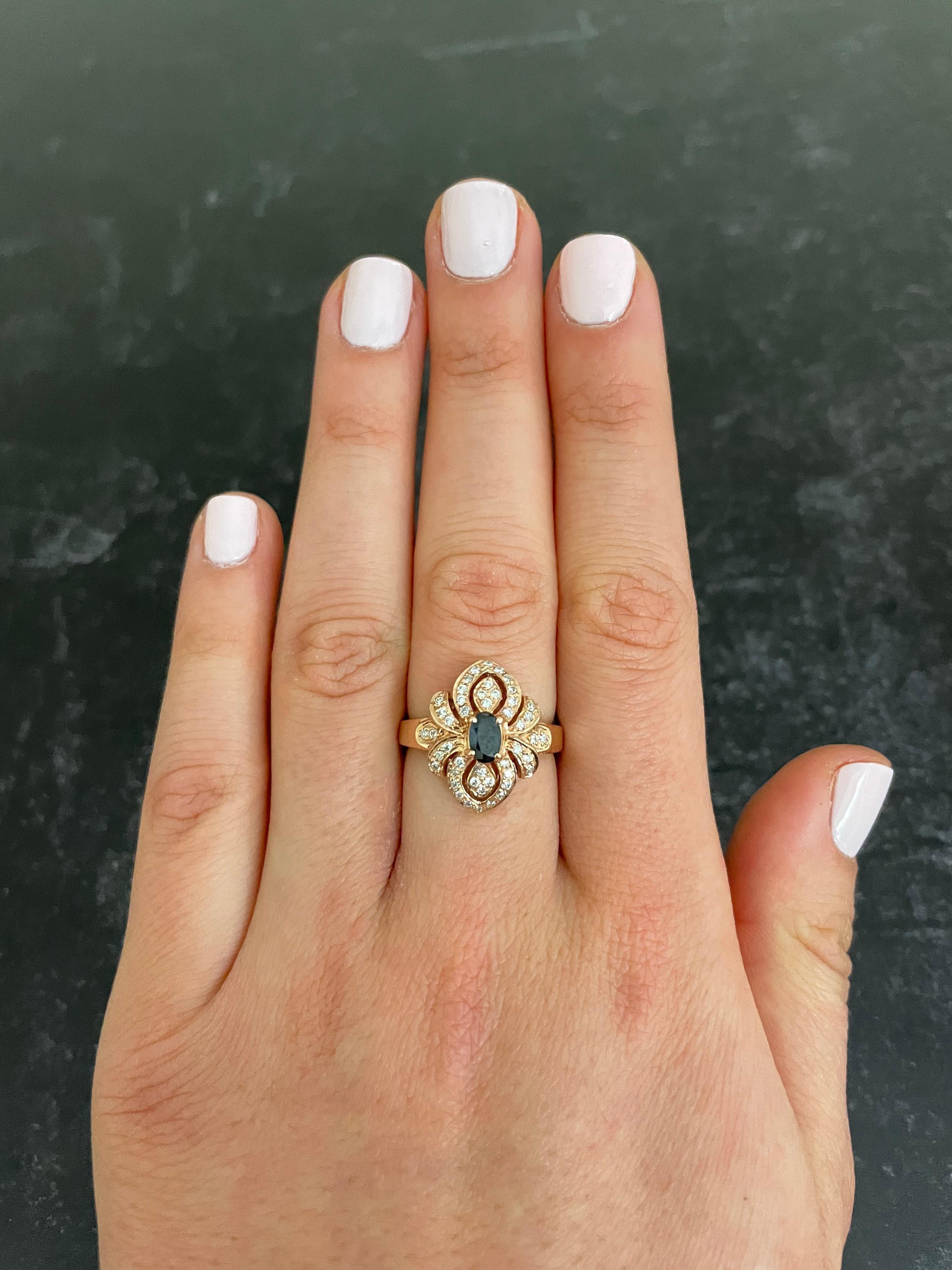 Material: 14k Rose Gold 
Center Stone Details: 1 Oval Shaped Alexandrite at 0.35 Carats Total- Measuring 4 x 5 mm
Mounting Diamond Details: 46 Brilliant Round White Diamonds at Approximately 0.30 Carats - Clarity: SI / Color: H-I
Ring Size: Size 6.5