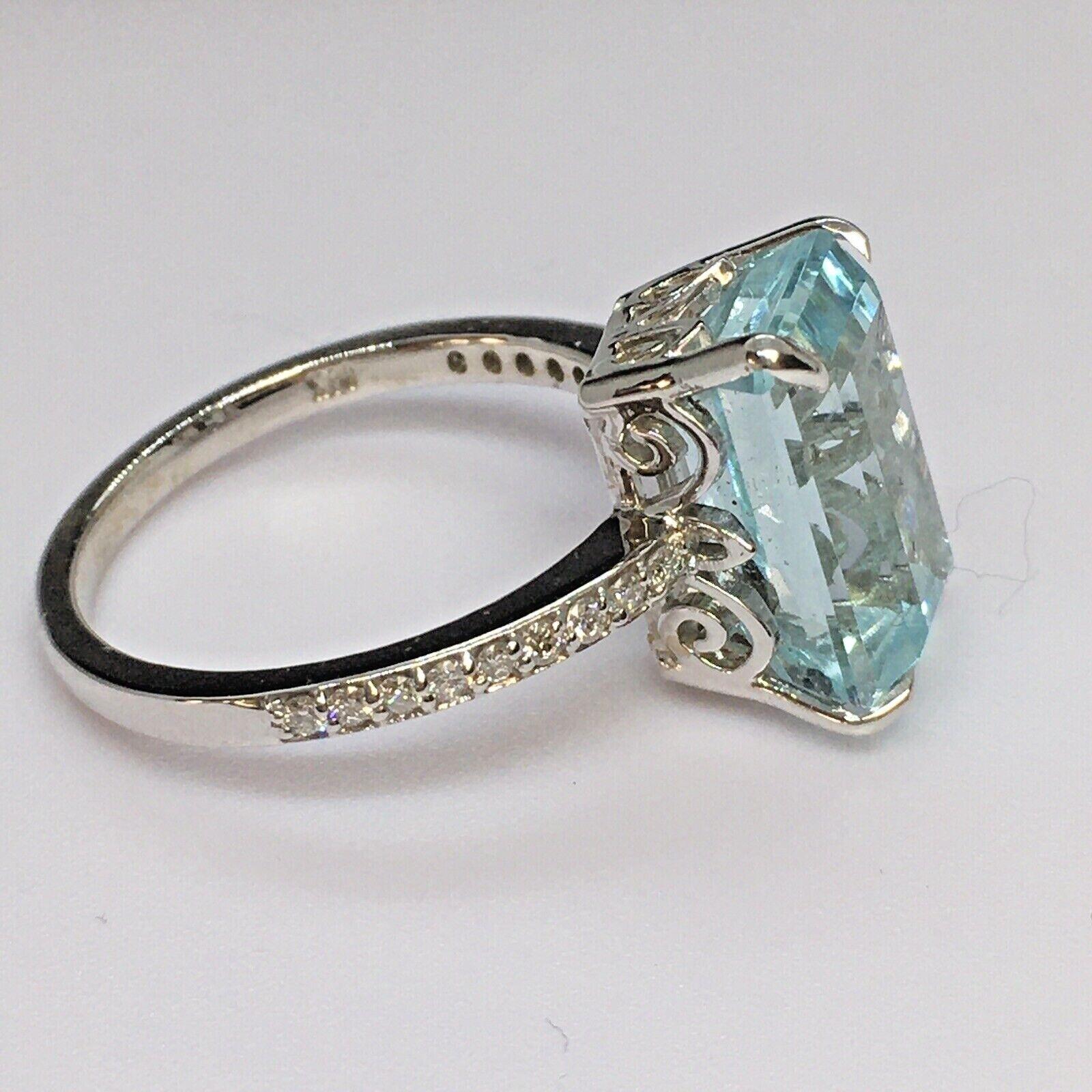 Natural Color Earth Mined 4.5 ct Aquamarine 1/4 Ct Diamond 14k White gold ring

A 12.8 mm by 8 mm by 6.1 mm, 4.5 Carat Earth Mined Aquamarine
Ring is weighting 4.1 gram 14K white gold
1/4 carat 18 pieces 1.3 mm E-F color, VS1 clarity Diamonds
Finger