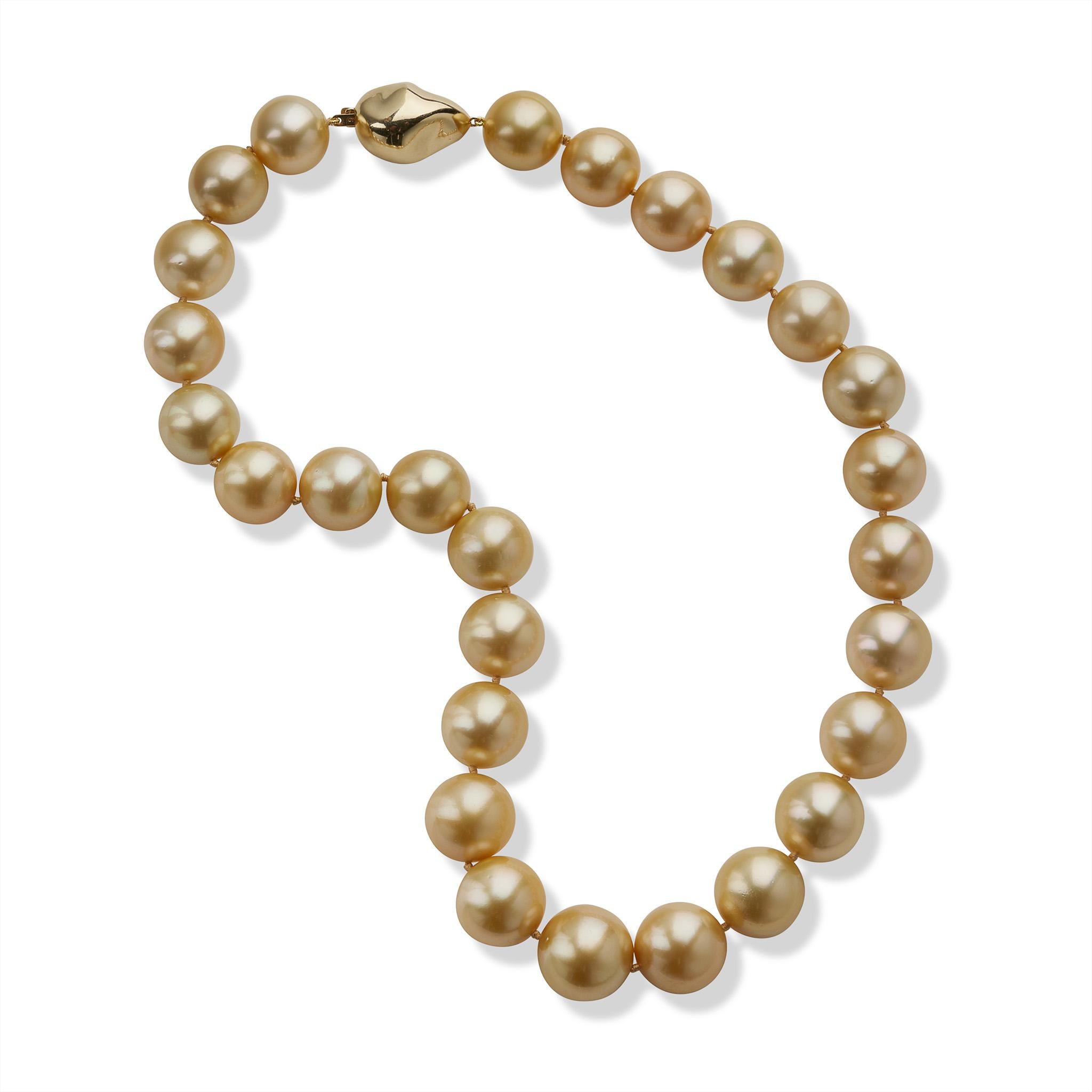This contemporary necklace is composed of 27 natural color golden cultured South Sea Pearls measuring approximately 17.20 to 15.00mm. Completed by a baroque pearl form 14K gold clasp, the round golden pearls have a touch of rose colored orient.