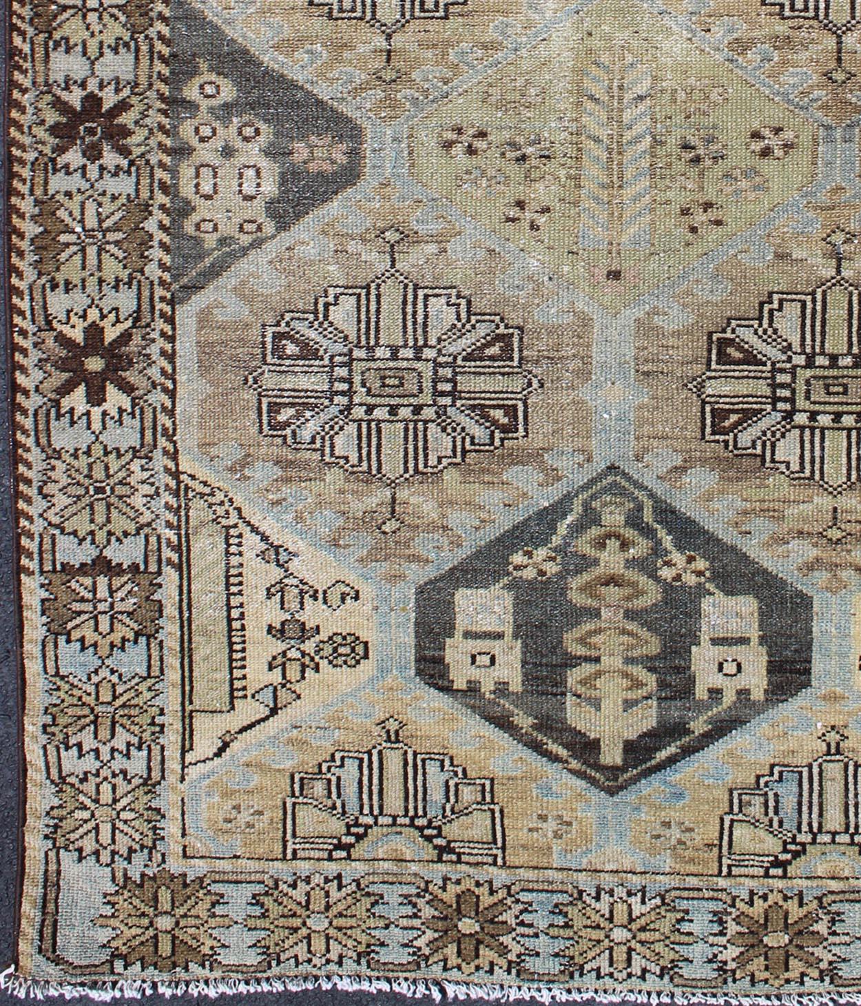 Persian Bakhtiari vintage rug with geometric design in gray, camel, tan, taupe, brown, rug gng-4745, country of origin / type: Iran / Bakhtiari, circa 1940s.

This vintage Persian Bakhtiari rug from mid-20th century Iran features an expansive
