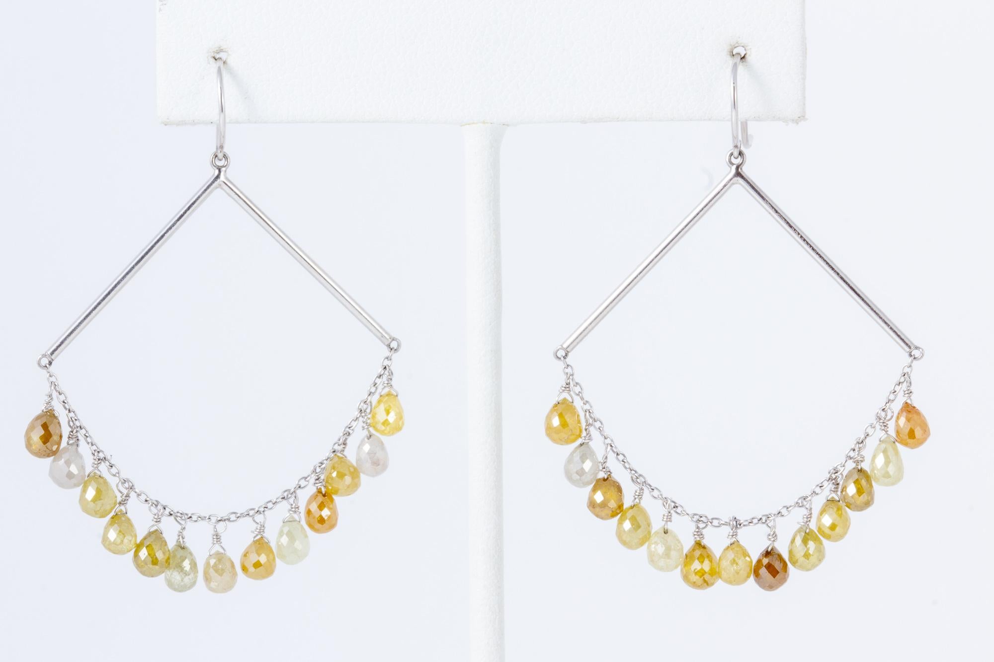 Contemporary earrings featuring a beautiful pallet of untreated natural colored diamonds.  These well faceted briolette stones, popular since the Victorian era have been paired with clean lines with a modern and edgy feel.  Dazzling in every