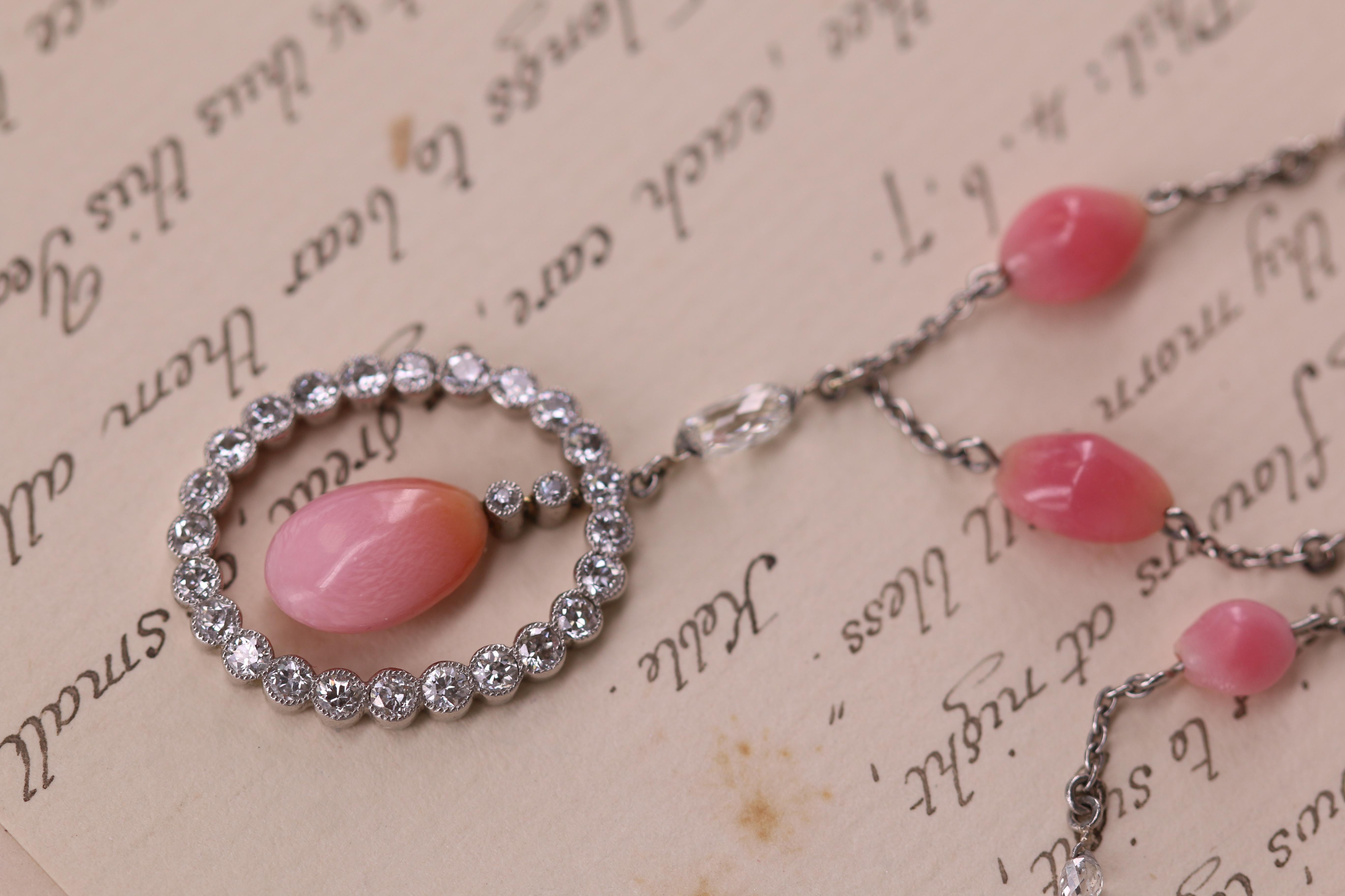 main pearl approx. 11.00 x 7.25 x 4.75 mm
weight:  9.9g;
Length. 18 1/2 in. 

This is a special pendant necklace. The conch pearls decorating the chain are a wonderful deep pink and are well matched. The bigger drop pearl in the pendant is a softer