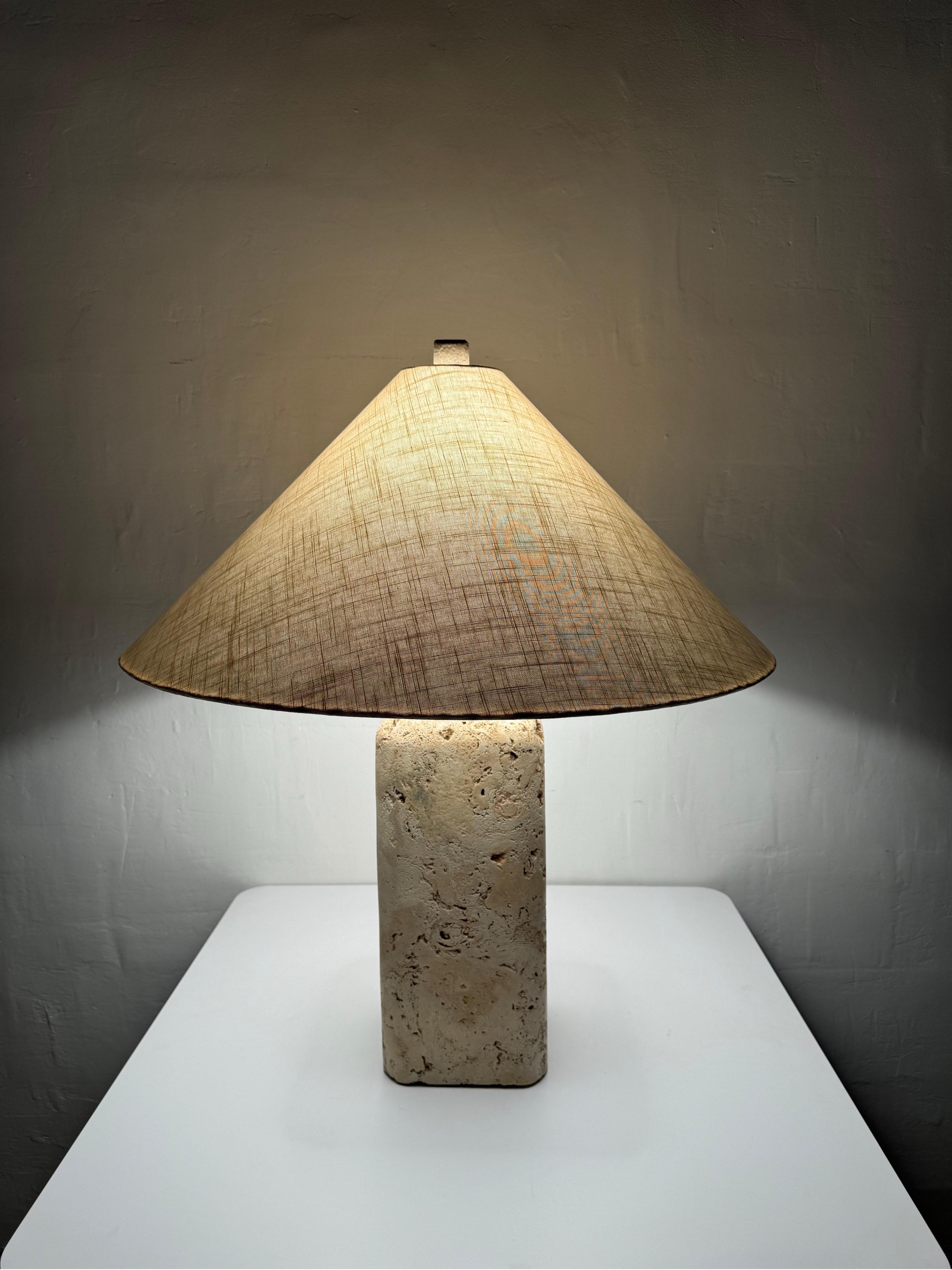 Natural coquina coral stone lamp with original fabric shade circa 1980s.

Additional Measurements:
Lamp Base w/o shade 7”x7��”x30.25”
Shade 26”x26”x11.5”