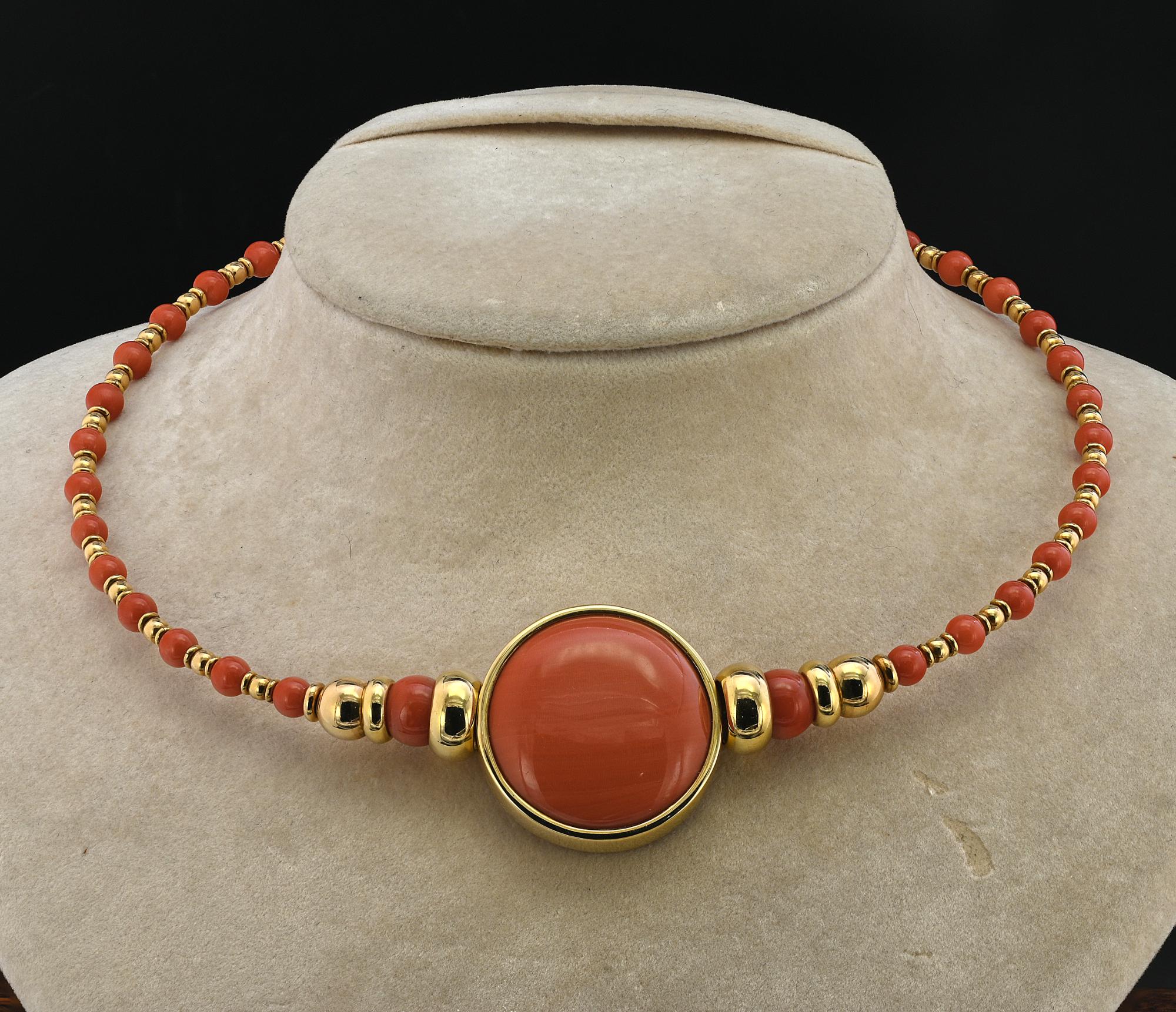 This marvelous 1980 circa Italian necklace is of chic design and beautifully made
A large centerpiece of 3 cm. including the gold frame made of the finest flawless quality natural Coral cabochon beautifully polished to perfection, fascinating color,
