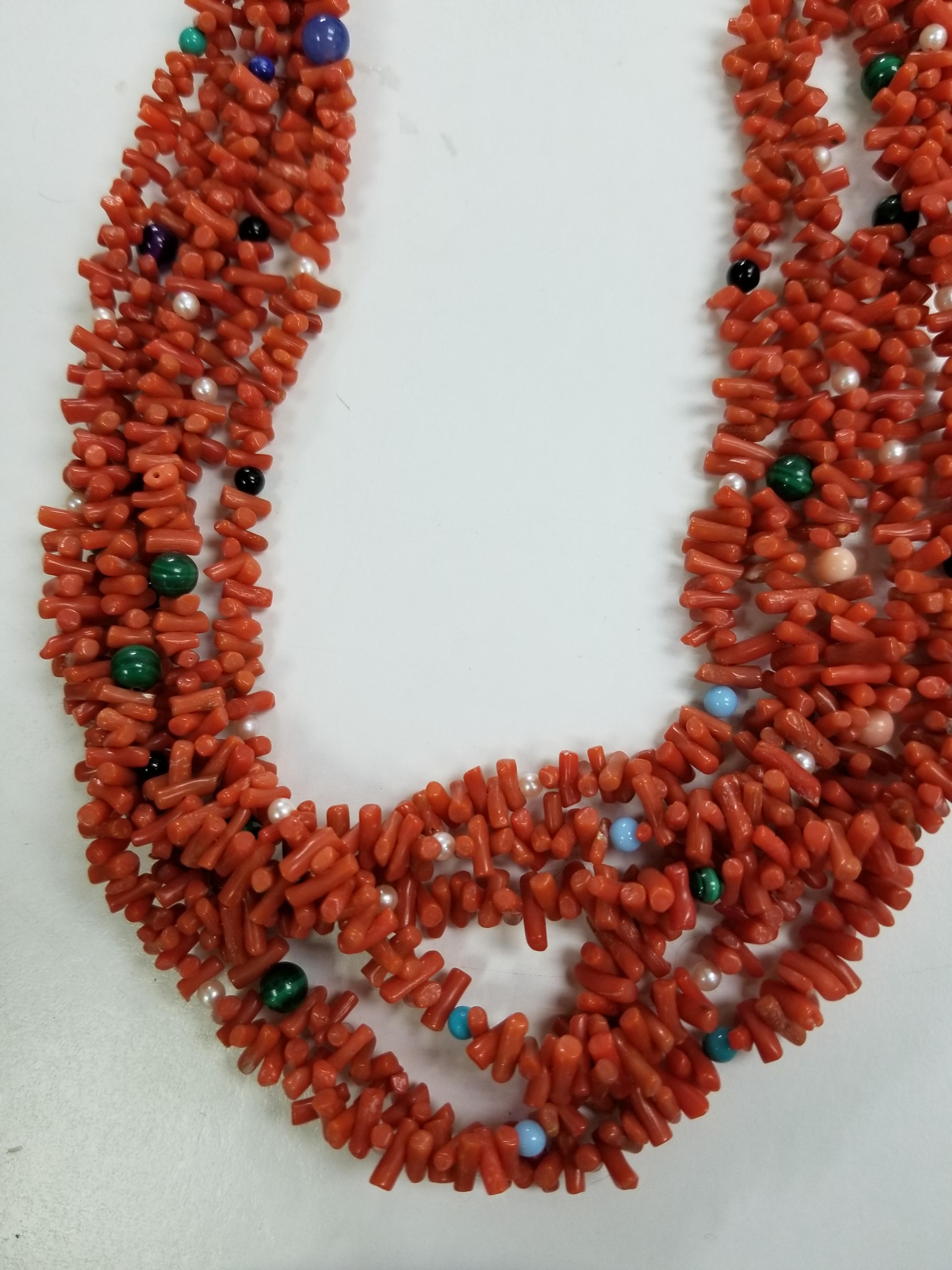 Southwest Necklace.  One strand natural highly polished red Coral beads enhanced with Turquoise beads connecting to a brass cap with six strands coral sticks with scattered semi-precious beads. This necklace is a pleasing 25 inch length with a 14k