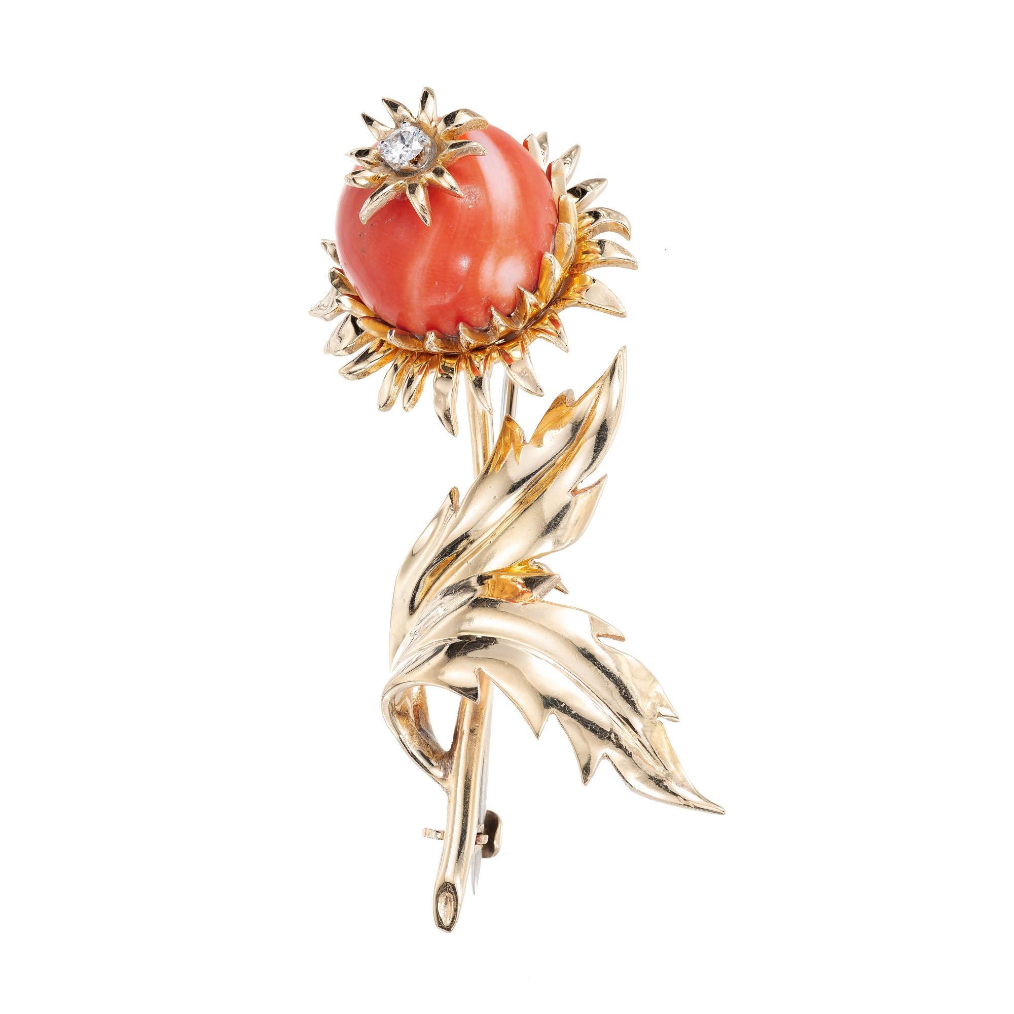 1950's natural coral and diamond 18k yellow gold brooch. Untreated orange red Coral with a full cut center diamond. 

1 round full cut Diamonds, approx. total weight .06ct, H, SI1
1 orange red natural Coral bead, 13mm
18k yellow gold
Tested and