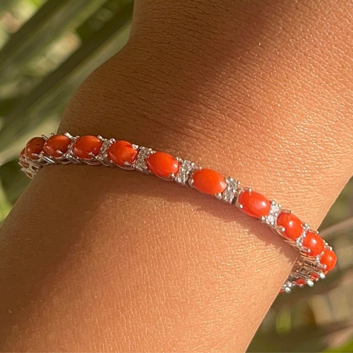 Natural Coral Oval Cabochon Zirconia Tennis Bracelet in sterling silver. You shall need statement tennis bracelet to make a statement with your look. Each piece features dazzling cubic zirconia stones, renowned for their brilliance and clarity, set