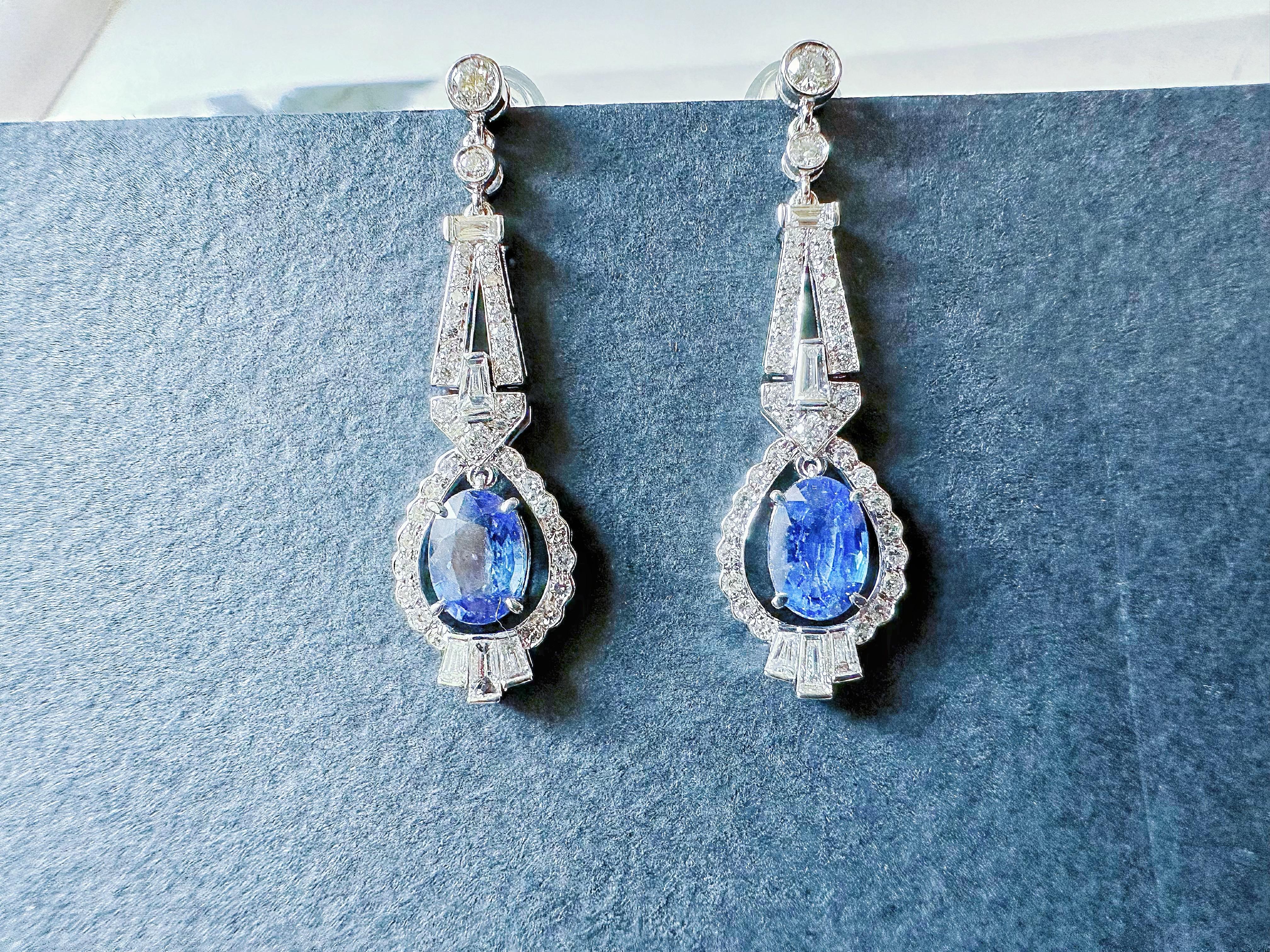 Discover the allure of two exquisite natural blue sapphires from Sri Lanka, elegantly adorned with brilliant diamonds in a simple yet modern design. Each pair of earrings is custom-designed and truly unique, ensuring that you possess a piece that is