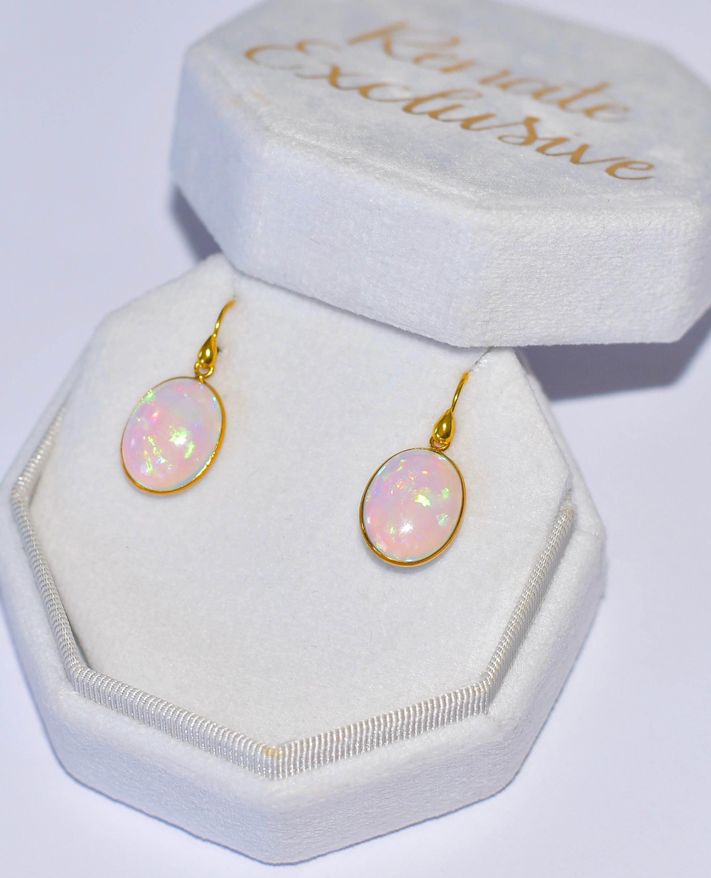 I ship all my products from the USA! 

Gorgeous Natural Crystal Opal Oval Bezel 18k Solid Yellow Gold Earrings! What flash and luxury! They're the perfect size to wear every day—light and shimmering!
Opal bezel size 13.6mmx17.3mm, 1.2 Inch total