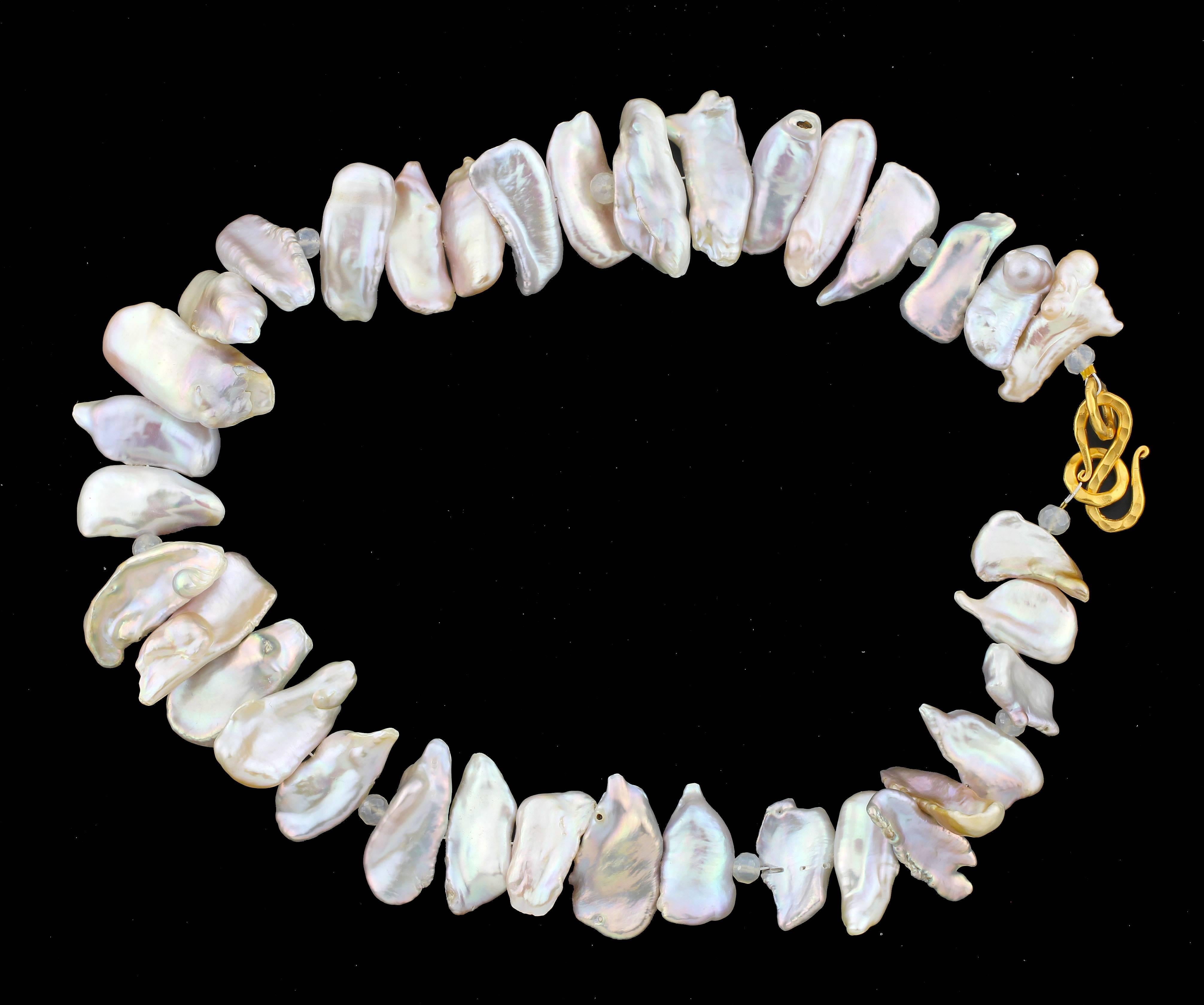 Goldy silvery and whitish cultured fresh water Pearls accented with little checkerboard gem cut Moonstones with a hammered gold plated clasp.  The colors glisten differently in different lights.  This is handmade, unique, and is 19 inches long. 