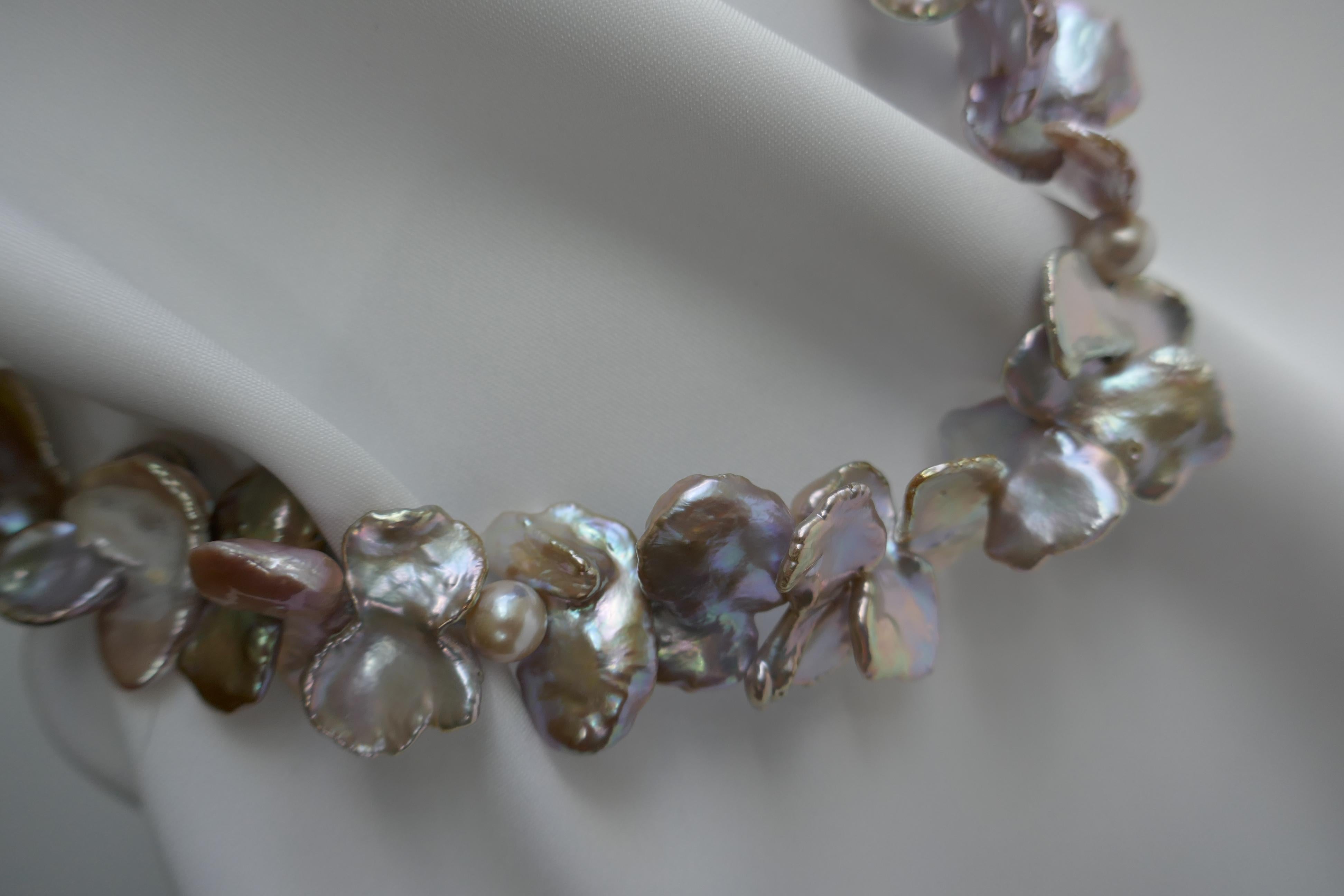 These keshi pearls on this necklace are beautiful and not easy to find. This is definitely a one of a kind statement necklace. The keshi pearls are in natural tones. The size is spectacular on these irregular shaped keshi pearls. The keshi pearls