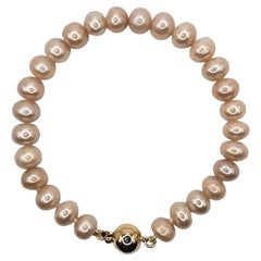 Bracelet de perles de culture roses naturelles avec fermoir en or jaune 14 carats