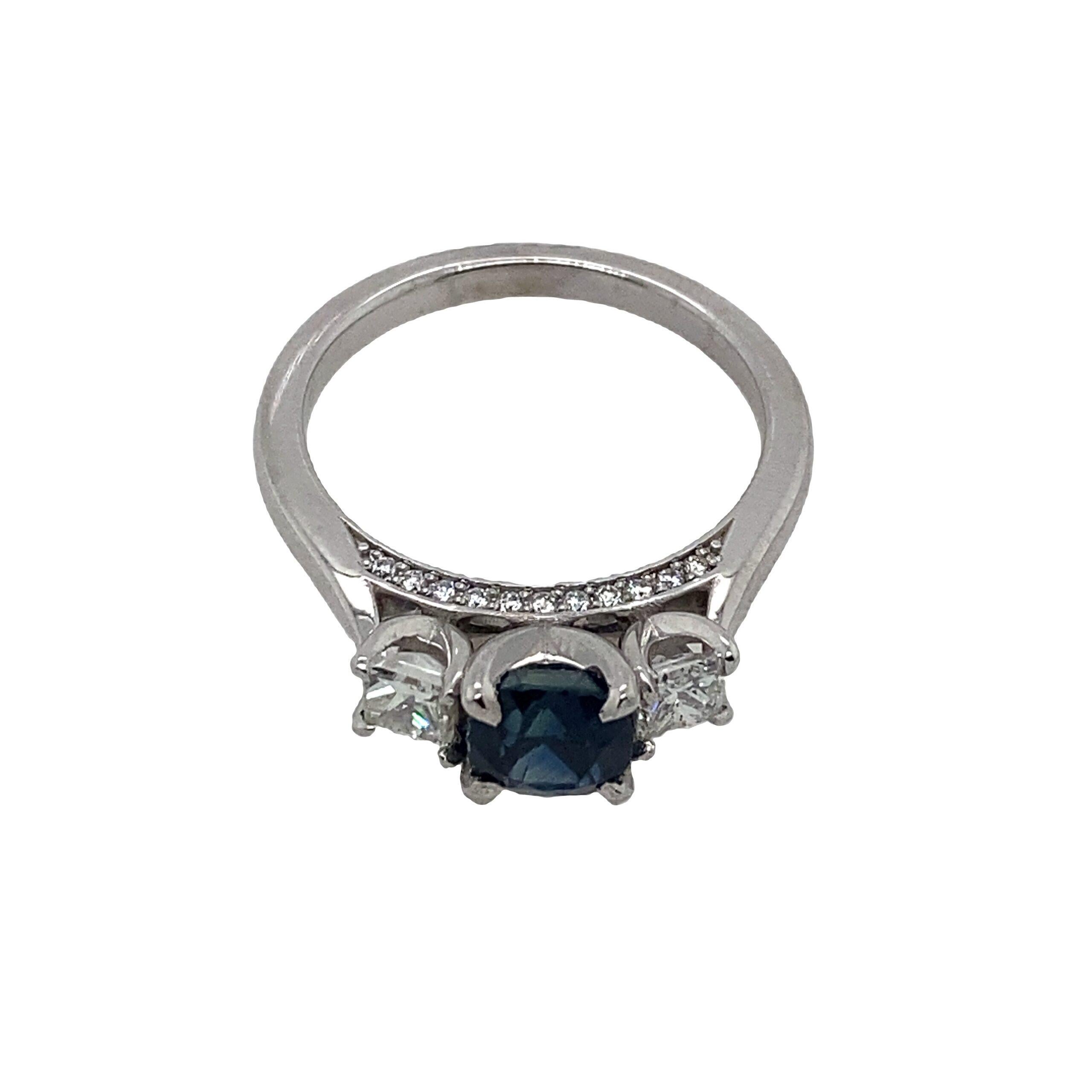 Natural Cushion Shape 1.12ct Sapphire and 0.52ct Diamond Ring Set in Platinum

Natural Cushion Shape Sapphire and Diamond Ring  Set in Platinum. With two 0.22ct Princess Cut Diamonds on each side. With 11 Diamonds on each side

Additional