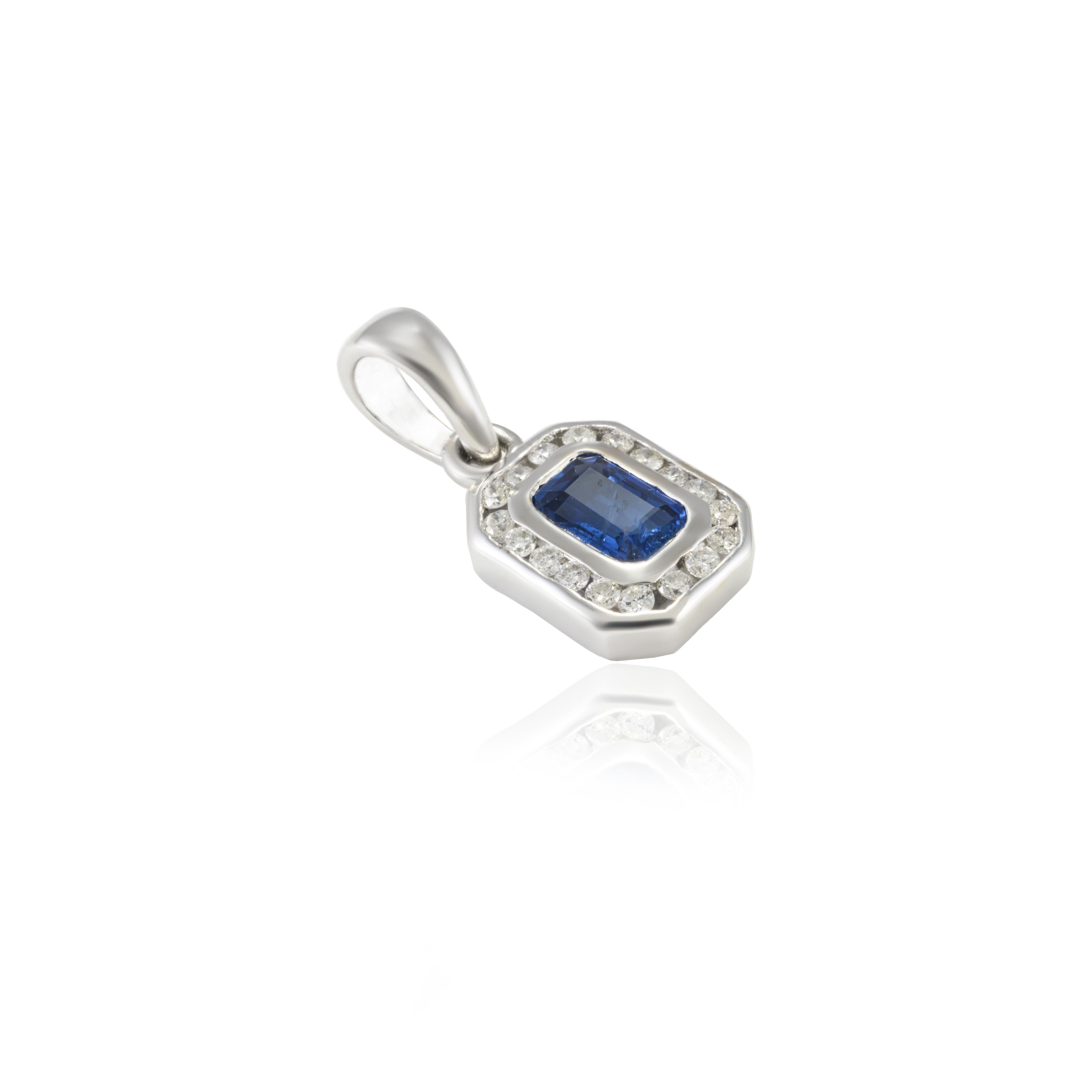 Octagon Blue Sapphire and Diamond Halo Pendant in 14K Gold studded with octagon cut blue sapphire. This stunning piece of jewelry instantly elevates a casual look or dressy outfit. 
Sapphire stimulates concentration and reduces stress.
Designed with